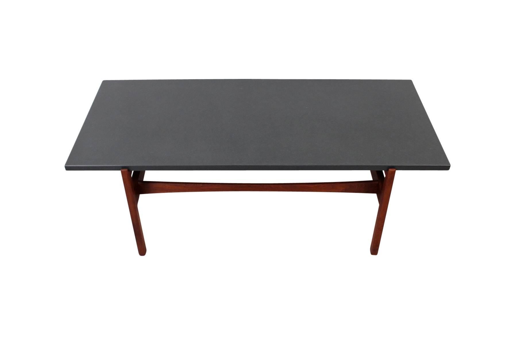 Rare coffee table model by Jens Risom with floating slate top over a walnut base. A gift from Risom to former owner.
 