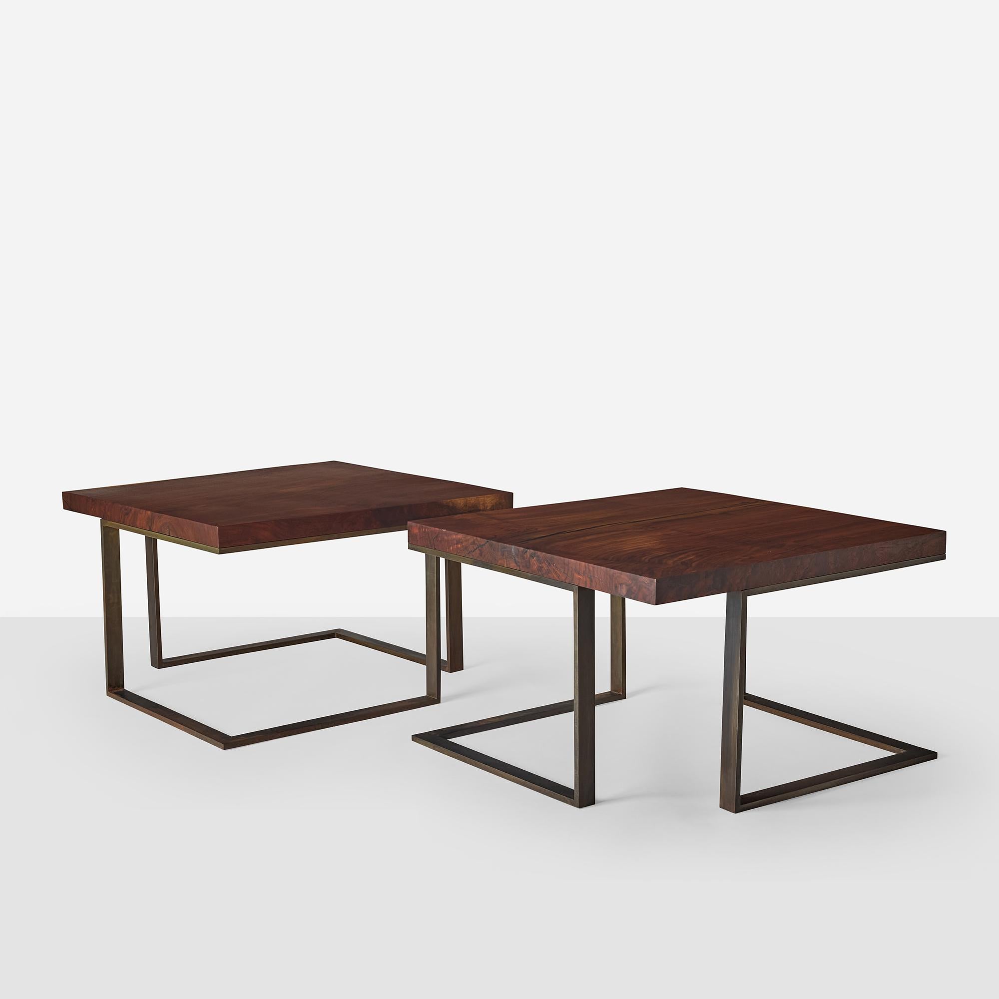 Square end tables with solid walnut tops on bronze-patinated steel bases. Contemporary pieces inspired by Milo Baughman designs.

Three available