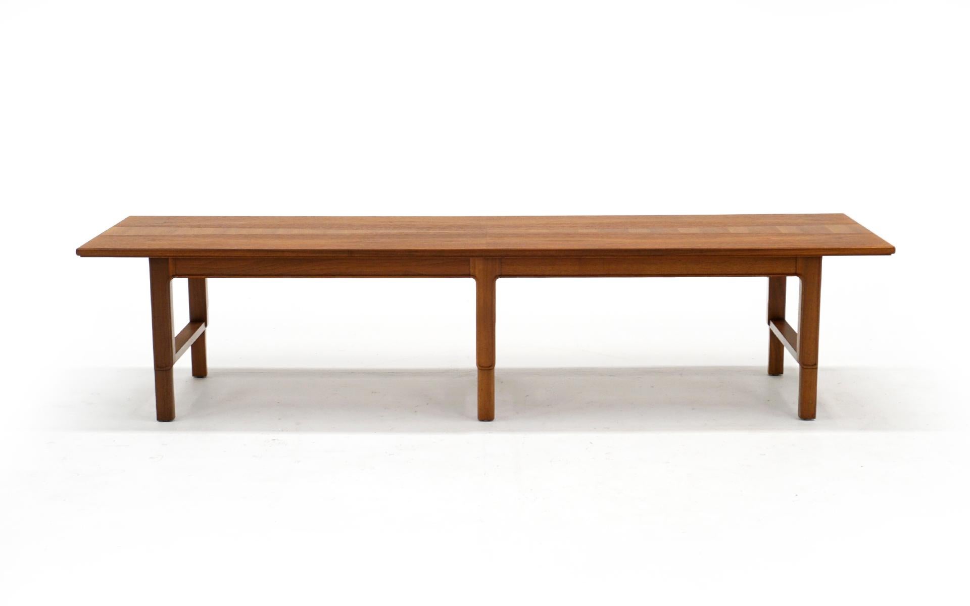 Walnut and teak coffee table or bench designed by Edward Wormley, produced by Dunbar. Expertly refinished. The walnut top is inlayed with a teak veneer design (see photos). We also have the original receipt of purchase. Excellent condition.