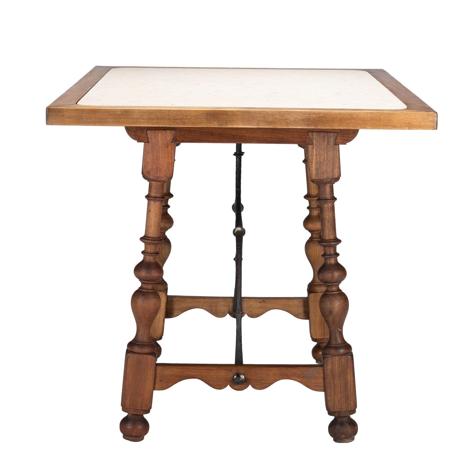 Walnut and travertine marble top table in the Spanish Baroque taste, 1925 In Excellent Condition For Sale In Kenilworth, IL