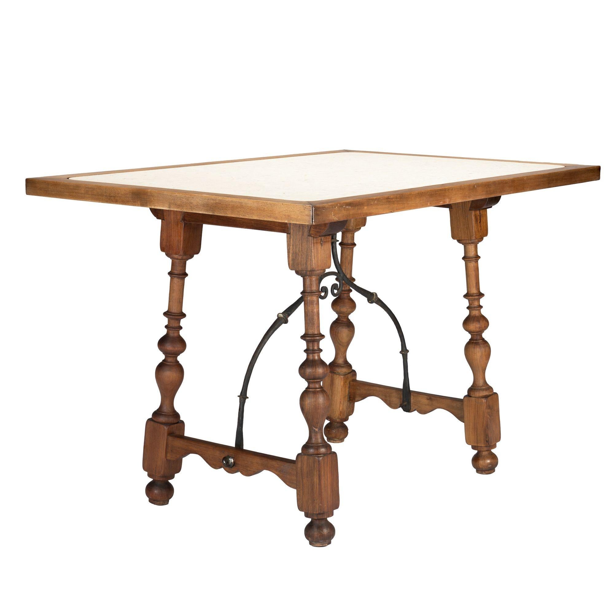 20th Century Walnut and travertine marble top table in the Spanish Baroque taste, 1925 For Sale
