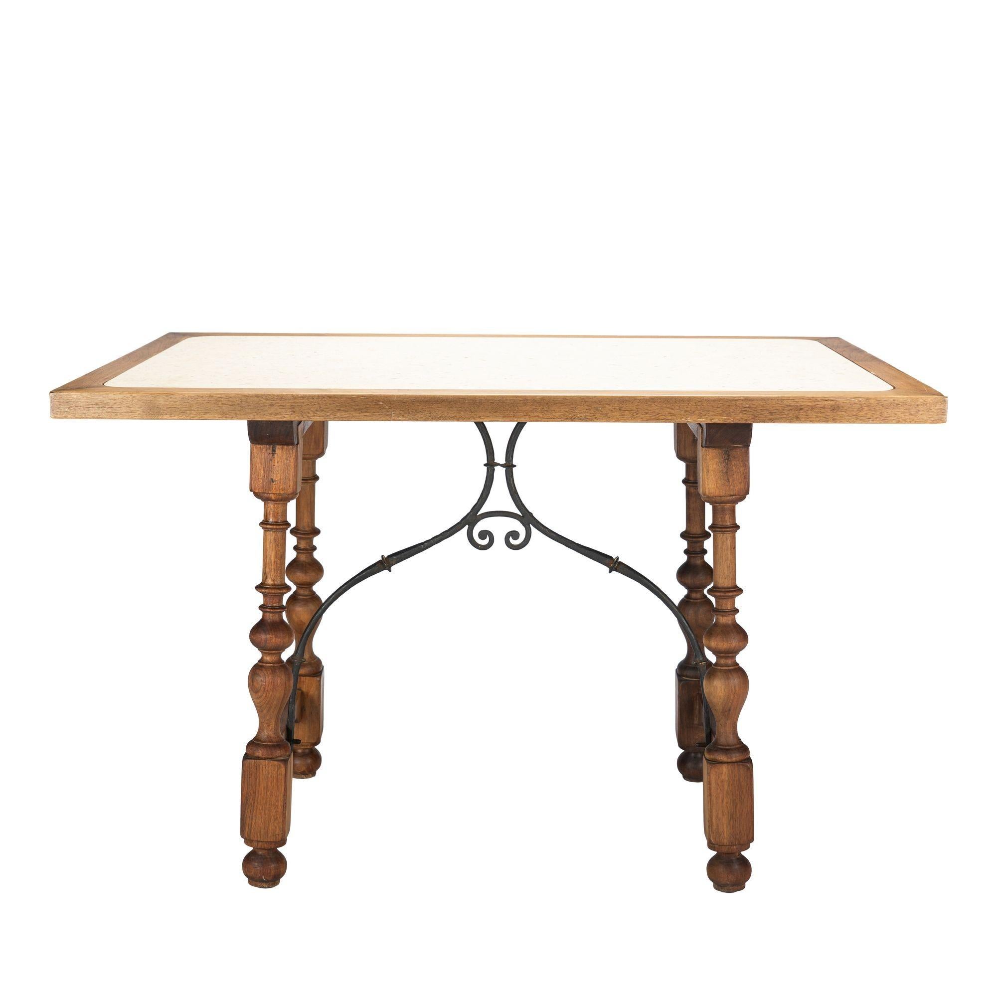 Iron Walnut and travertine marble top table in the Spanish Baroque taste, 1925 For Sale