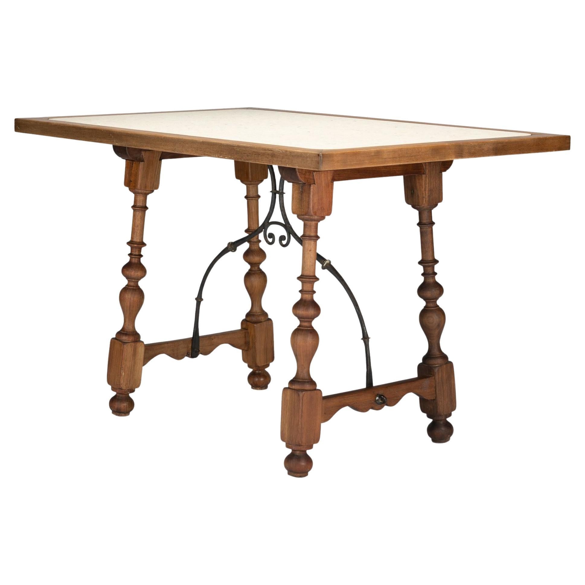 Walnut and travertine marble top table in the Spanish Baroque taste, 1925 For Sale