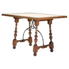 Walnut and travertine marble top table in the Spanish Baroque taste, 1925