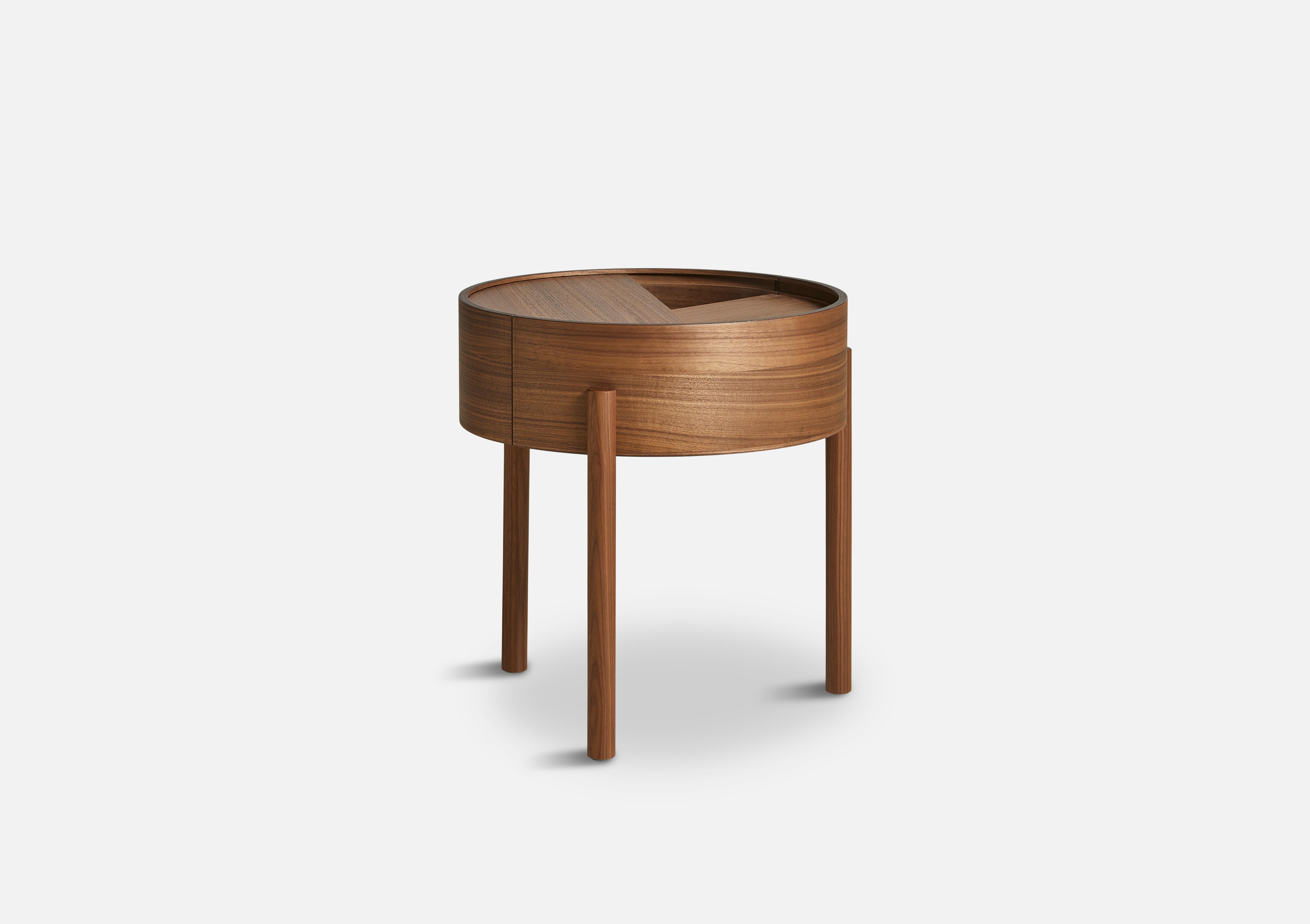 Walnut Arc side table by Ditte Vad and Julie Bertrup.
Materials: Walnut, Nano Laminate.
Dimensions: D 42 x W 42 x H 45 cm.

The founders, Mia and Torben Koed, decided to put their 30 years of experience into a new project. It was time for a