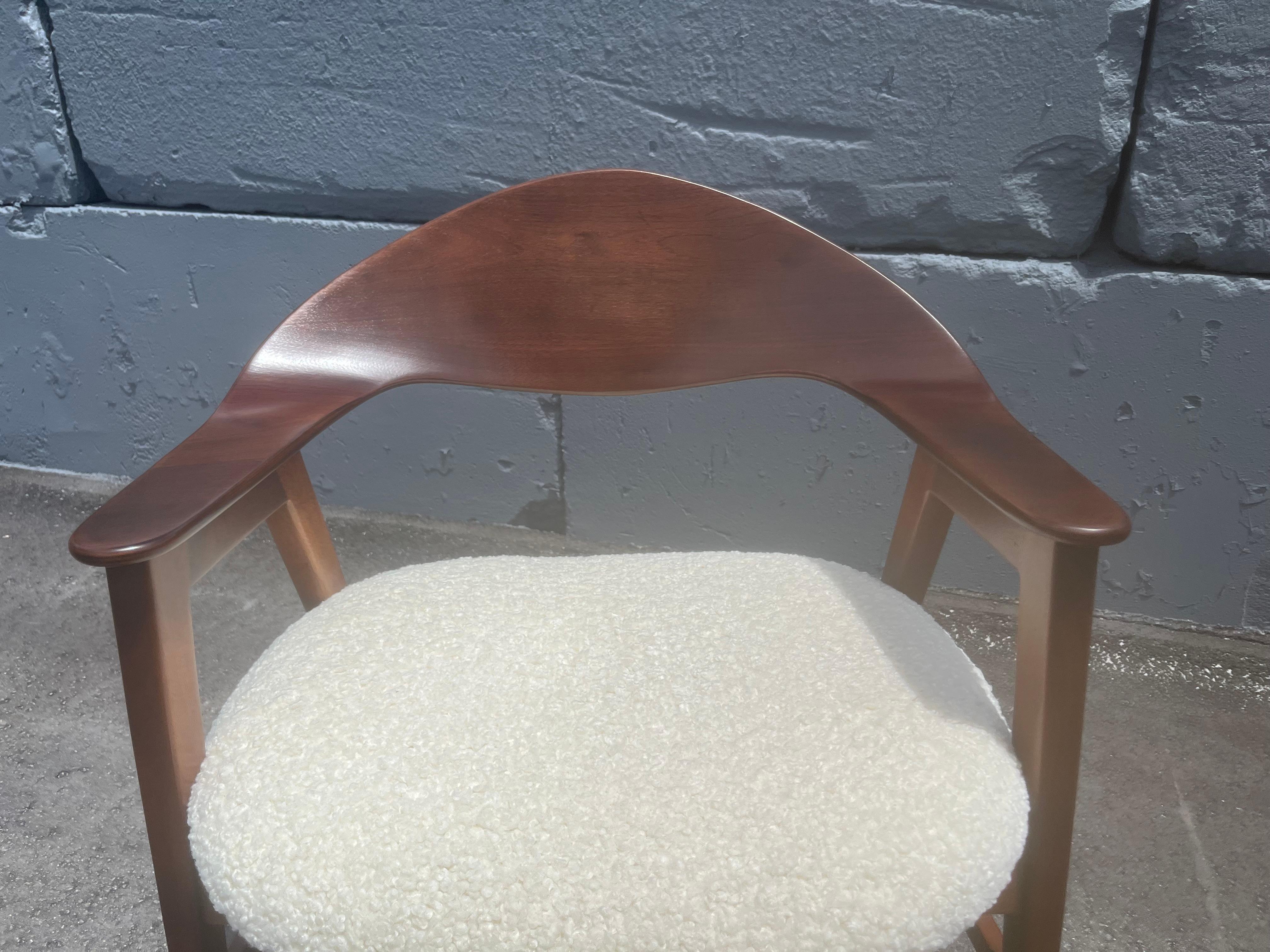 Walnut Arm Chair in the style of Ejner Larsen & Aksel Bender Madsen. Seat is in new cream boucle fabric. Ready for a new home. Made by Marbel Furniture, USA 1950s.