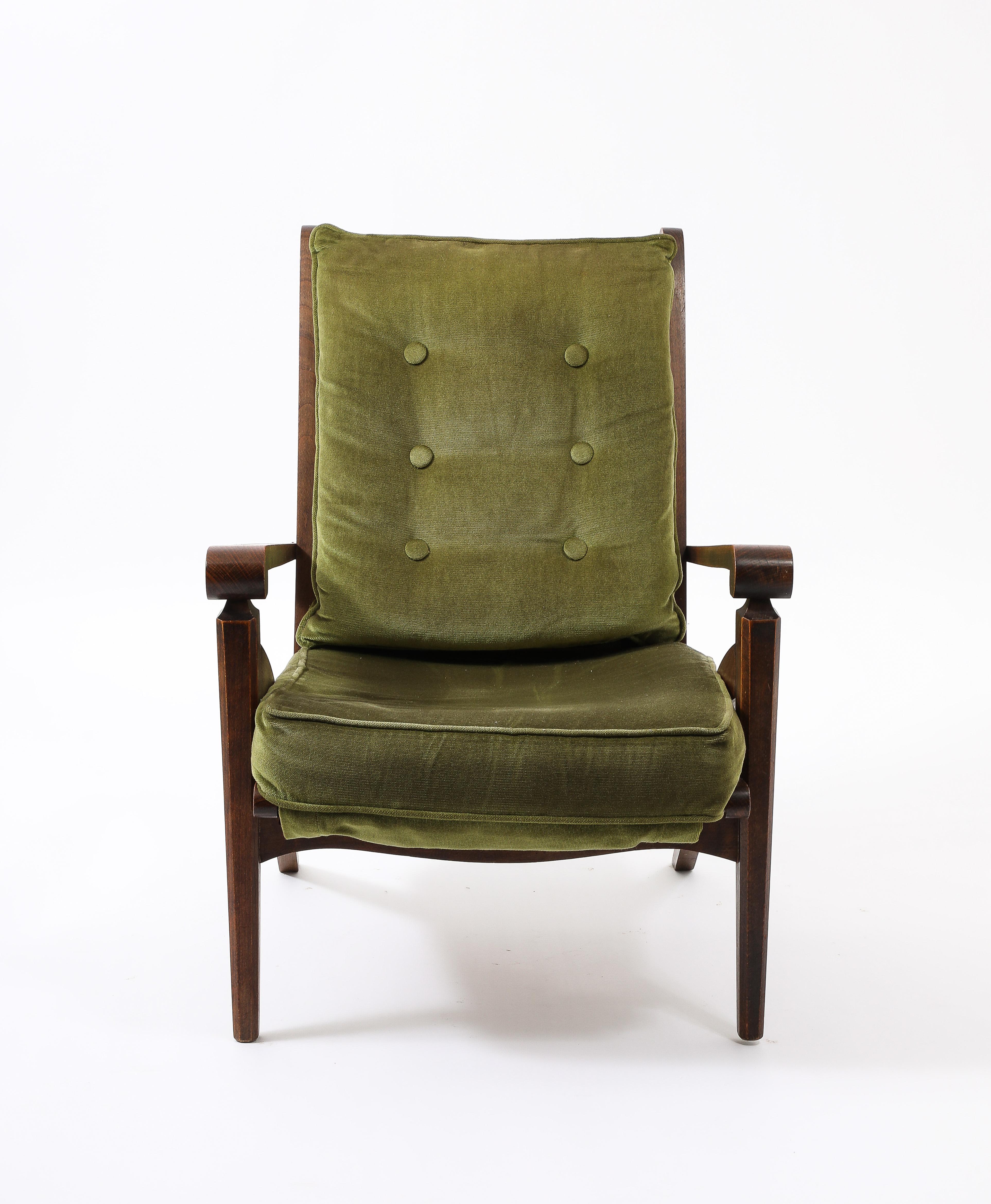 Walnut armchair with original velvet upholstery. Presented as is, refinishing and COM upholstery is Available.

France 1950’s
