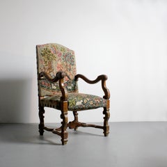 Walnut armchair with H-shaped stretcher and petit point embroidered upholstery