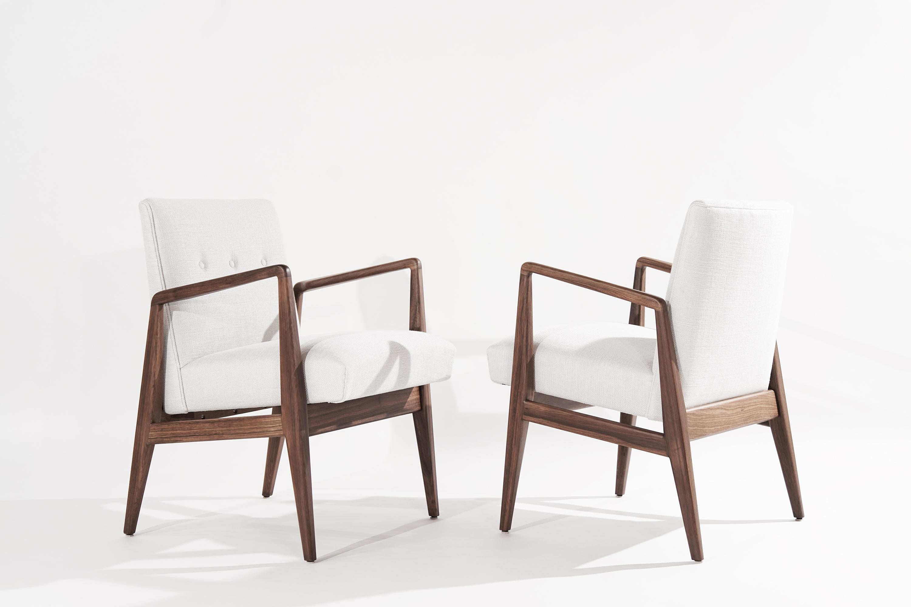 A set of armchairs designed by Jens Risom, circa 1950s. The beautiful walnut frames have been completely restored, matching their original natural organic finish. Reupholstered in light grey twill by Holly Hunt.

Other designers from this era