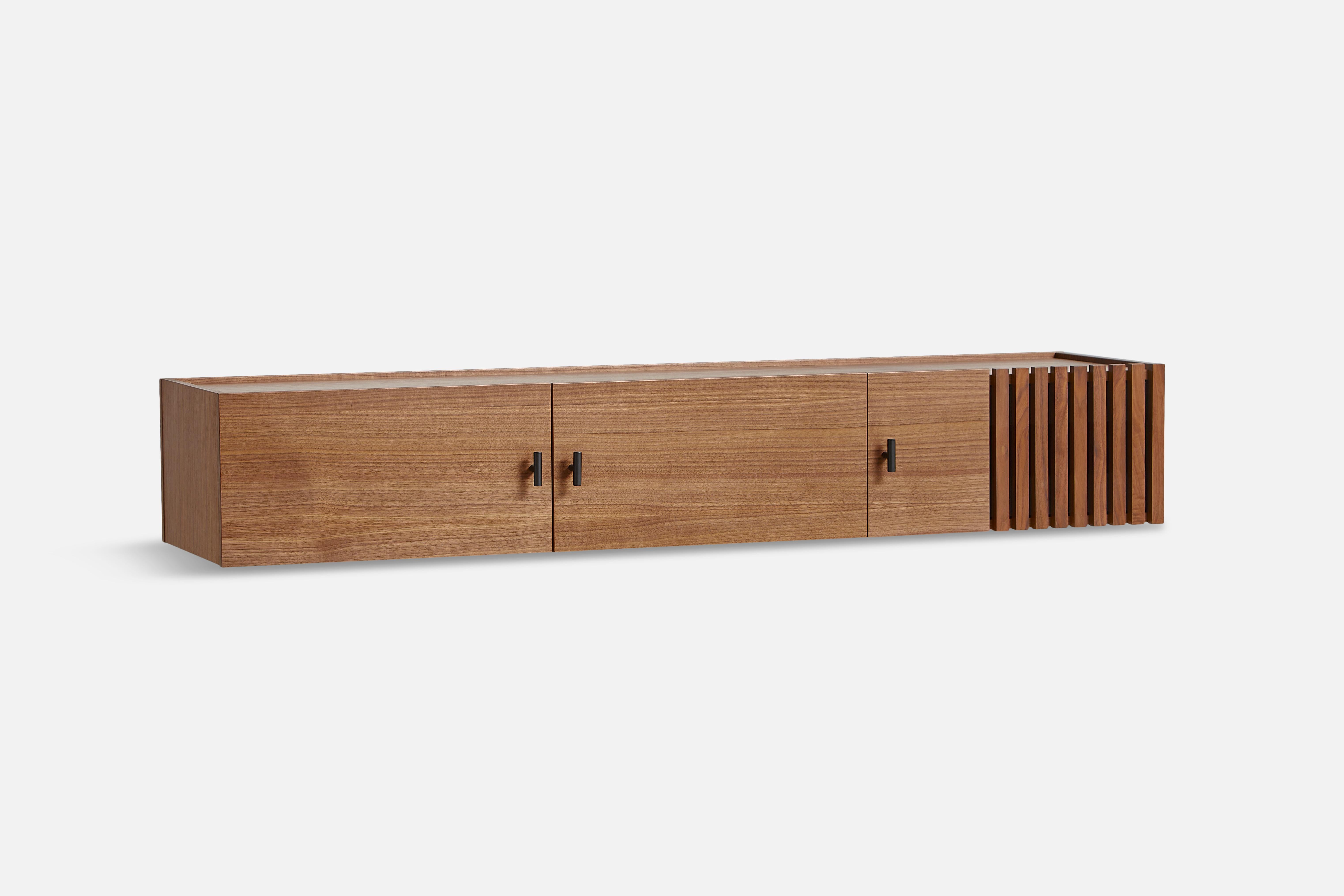 Walnut array low sideboard 150 by Says Who
Materials: walnut, metal
Dimensions: D 37 x W 150 x H 25 cm
Also available in different colours and materials.

The founders, Mia and Torben Koed, decided to put their 30 years of experience into a new