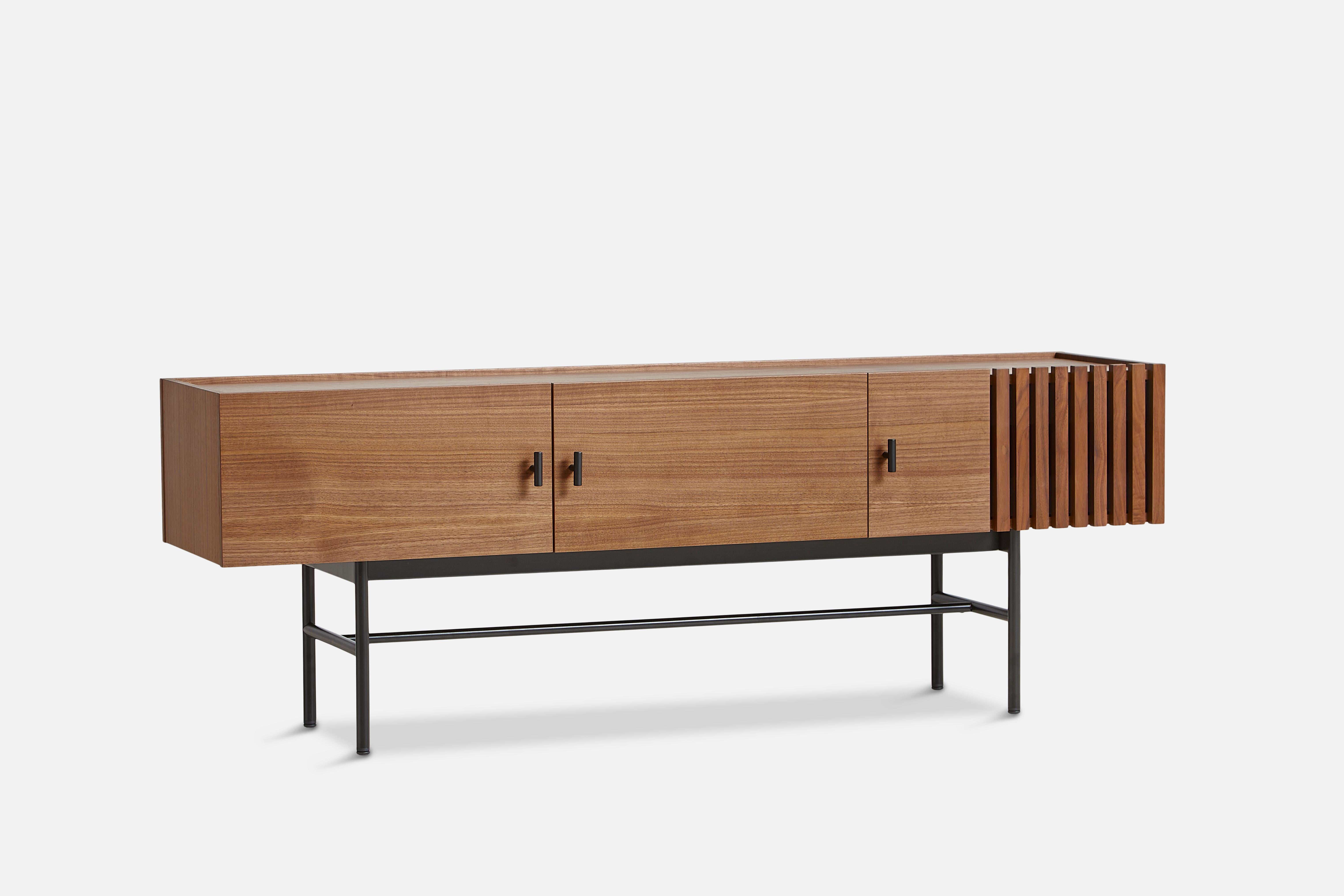 Walnut array low sideboard 150 leg frame by Says Who
Materials: walnut, metal
Dimensions: D 37 x W 150 x H 53 cm
Also available in different colours and materials. Please contact us.

The founders, Mia and Torben Koed, decided to put their 30