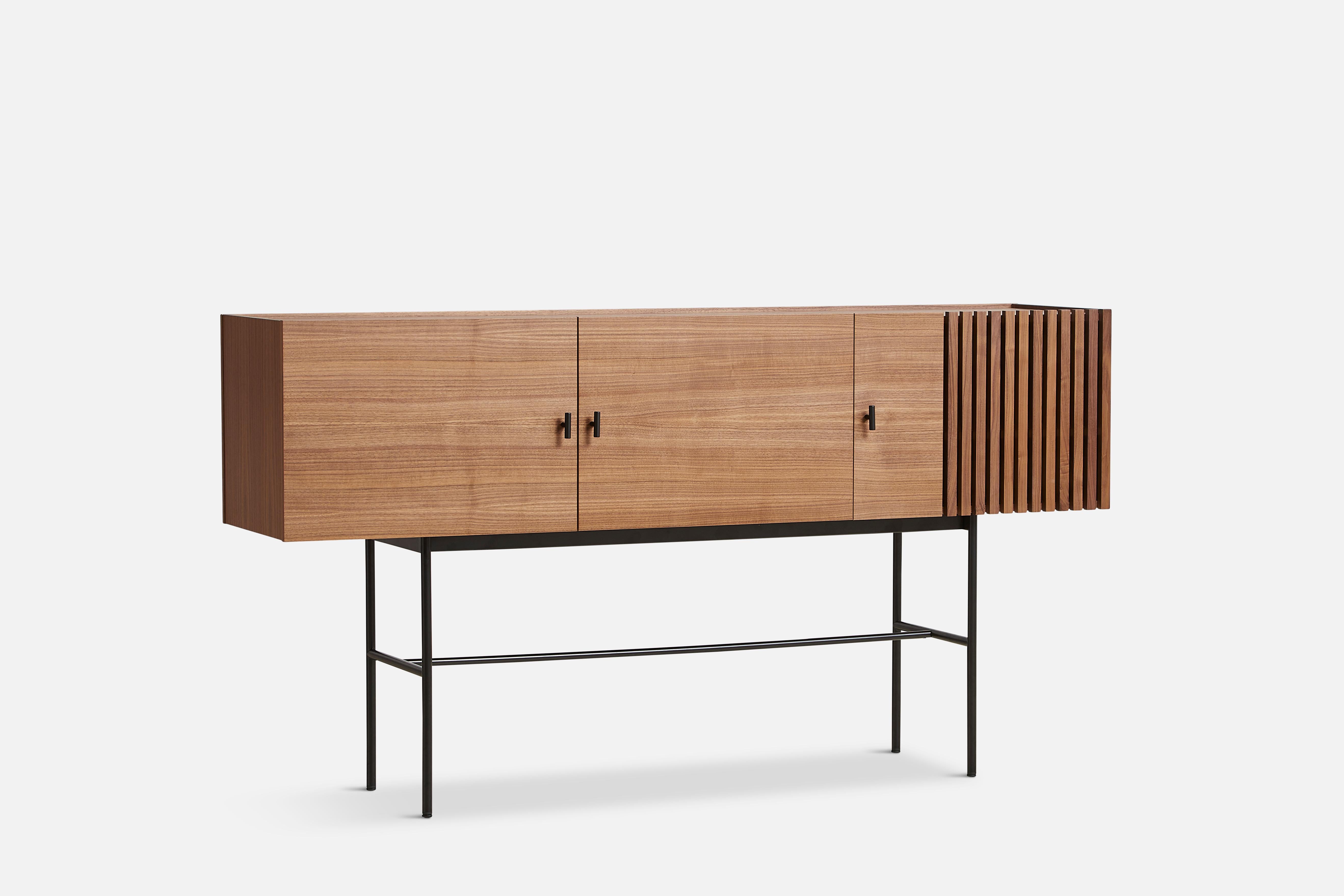 Walnut array sideboard 180 by Says Who
Materials: walnut, metal.
Dimensions: D 44 x W 180 x H 97 cm.
Also available in different colours and materials. 

The founders, Mia and Torben Koed, decided to put their 30 years of experience into a new