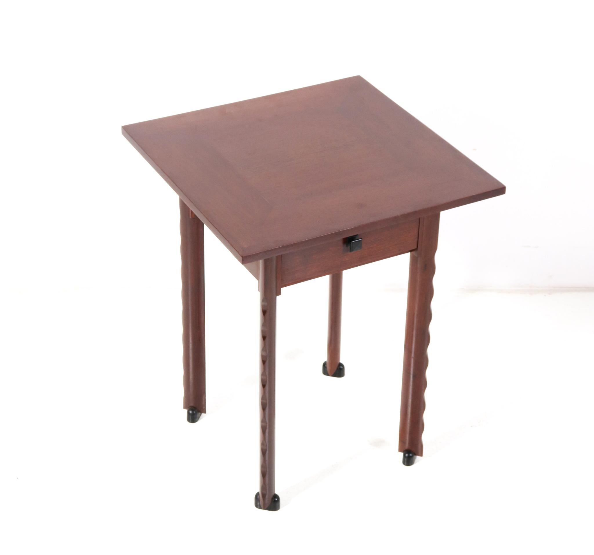 Magnificent and ultra rare game table or card table.
Design by C.H. Eckhart Rotterdam.
Striking Dutch design from the 1920s.
Solid walnut base with original walnut veneered top.
Four drop front flaps with four original stylish solid ebony