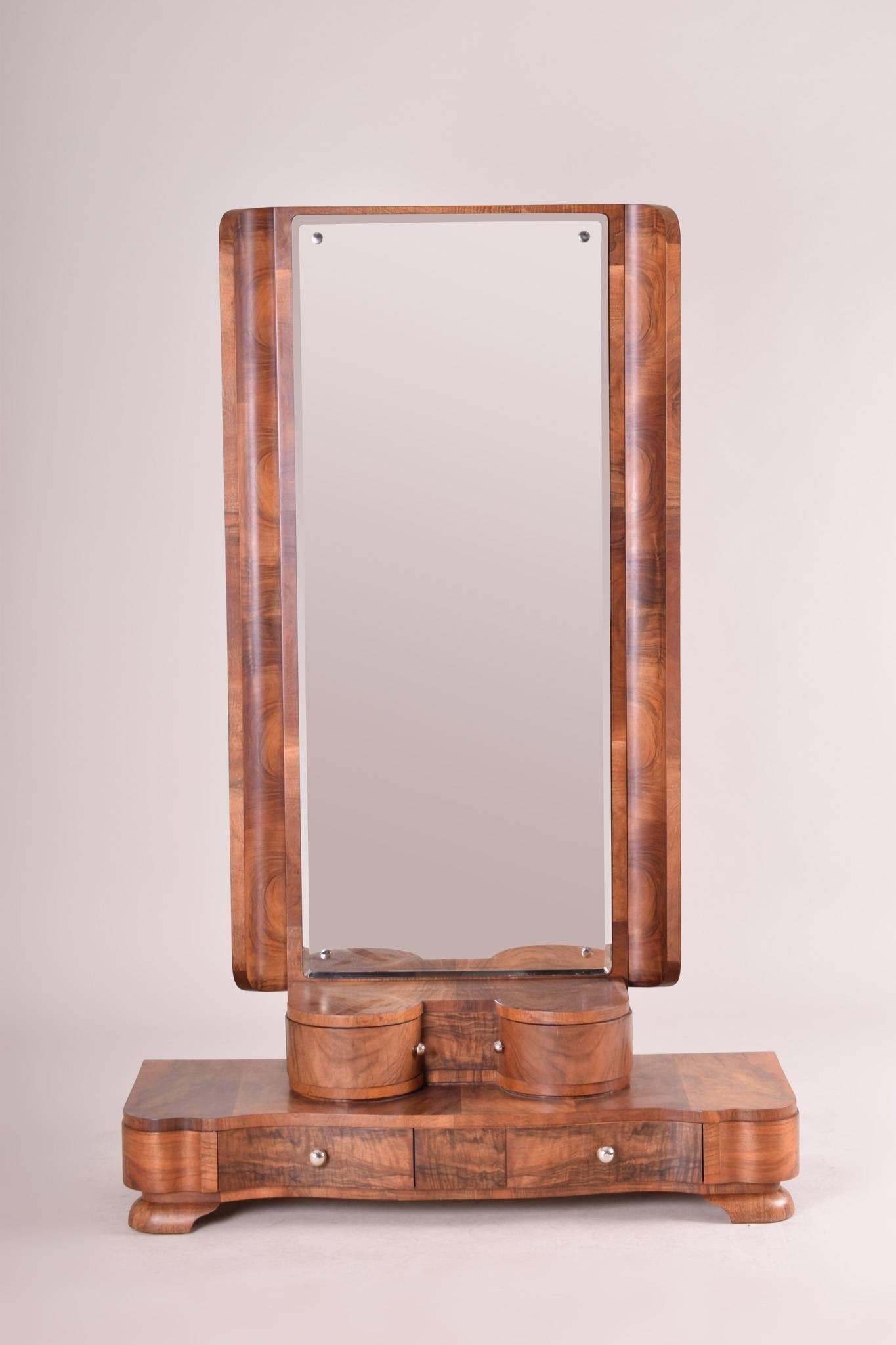 Art Deco mirror
Period: 1920-1929. 
Material: Palisander. 
Completely restored and the surface was made by lacquers to the half matt.