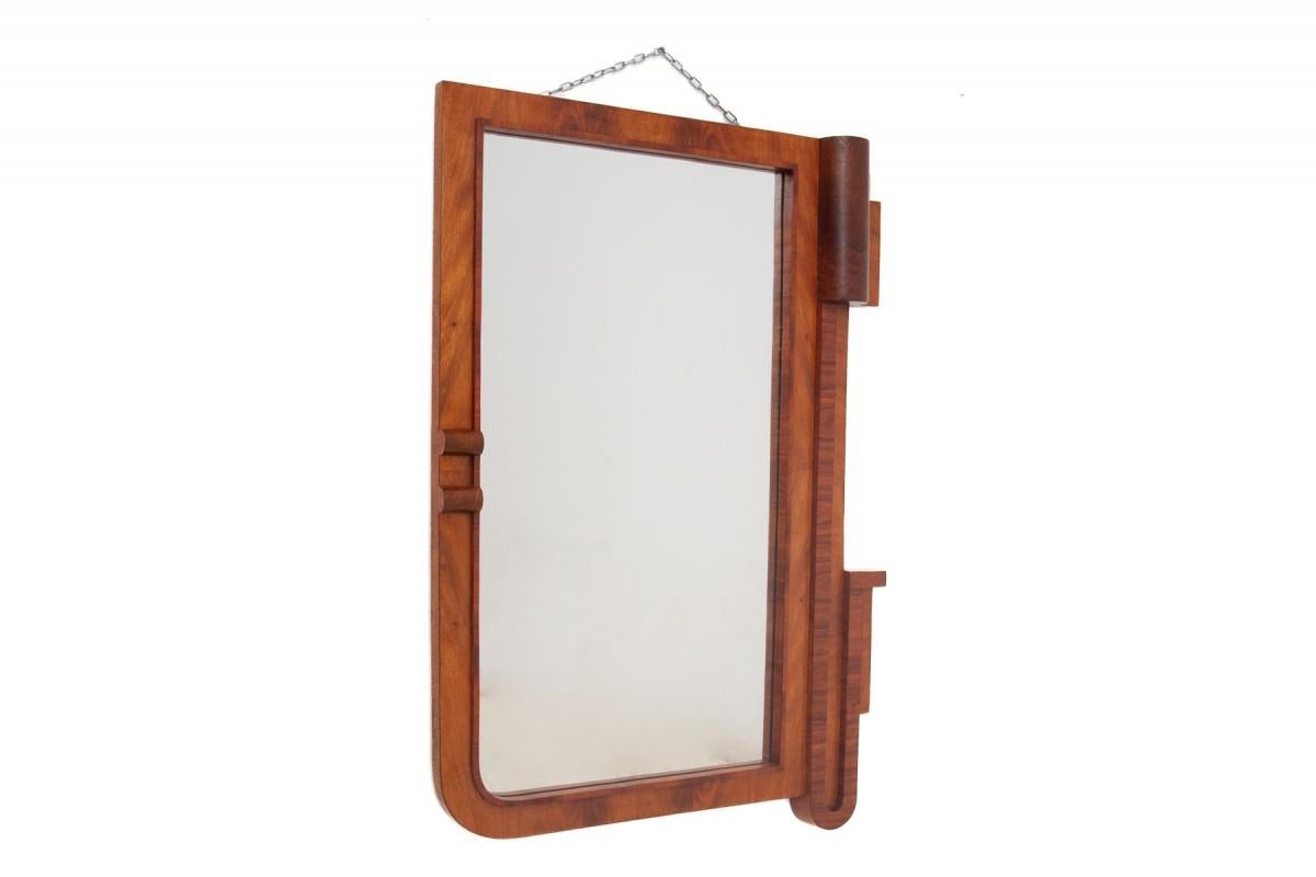 Vintage walnut mirror, after renovation. It comes from Poland from the 1950s. Wood finished in a semi-matt finish.

Dimensions:

Height: 105cm

Width: 74cm

Depth: 10cm