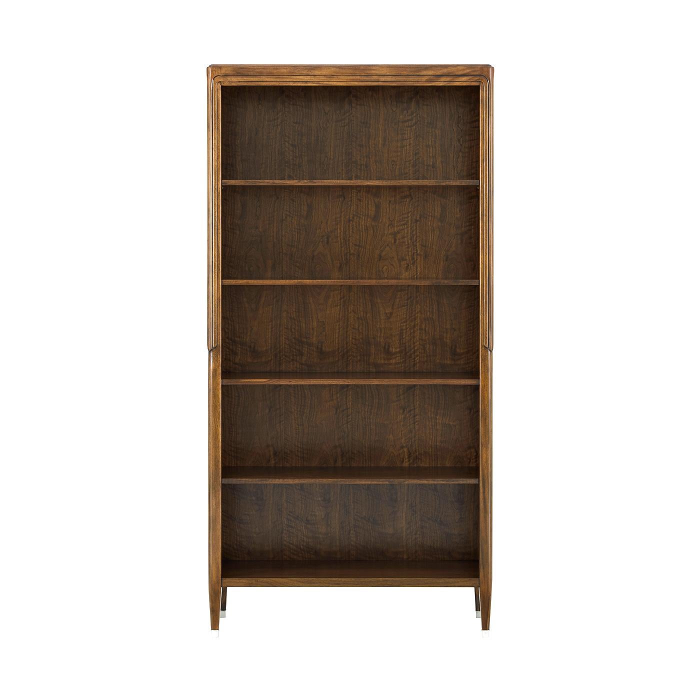 Bookcase embodies refined craftsmanship with its five-shelf design, inspired by the Art Origins period. A rounded, stepped motif accentuates its sleek form, while the thin, tapered legs provide a delicate yet sturdy foundation. Crafted with figured