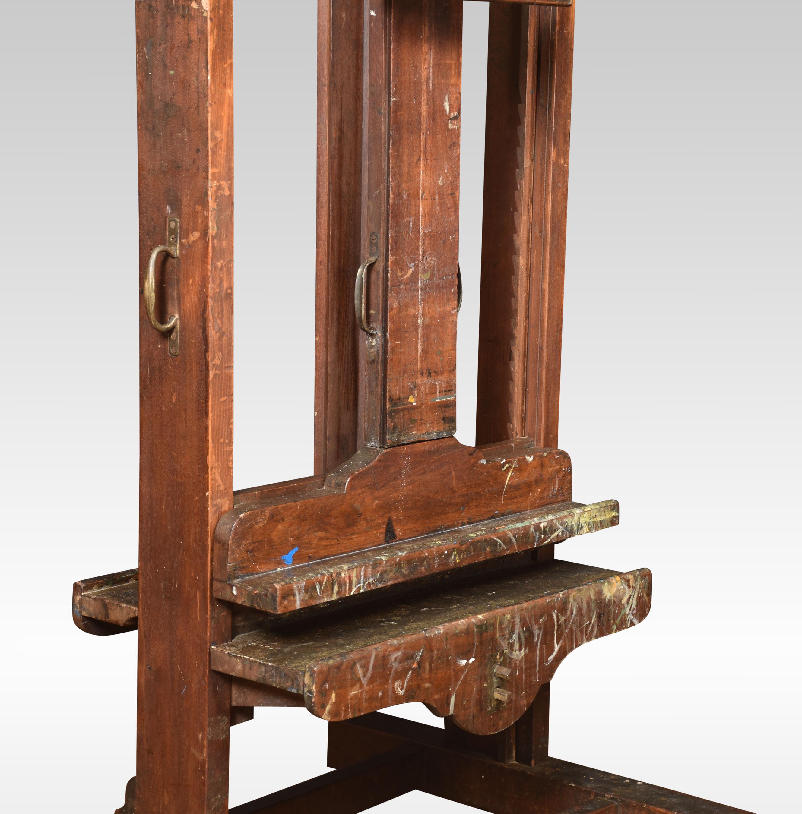 Walnut artist’s double-sided easel, with adjustable mechanism, raised up on trestle base terminating in casters
Dimensions:
Height 78 Inches
Width 27 Inches
Depth 30 Inches.