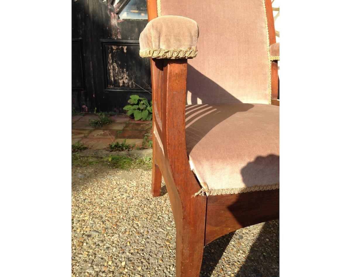 Early 20th Century Walnut Arts & Crafts Armchair with Pyramidal Top Details & Curved Out Arms For Sale