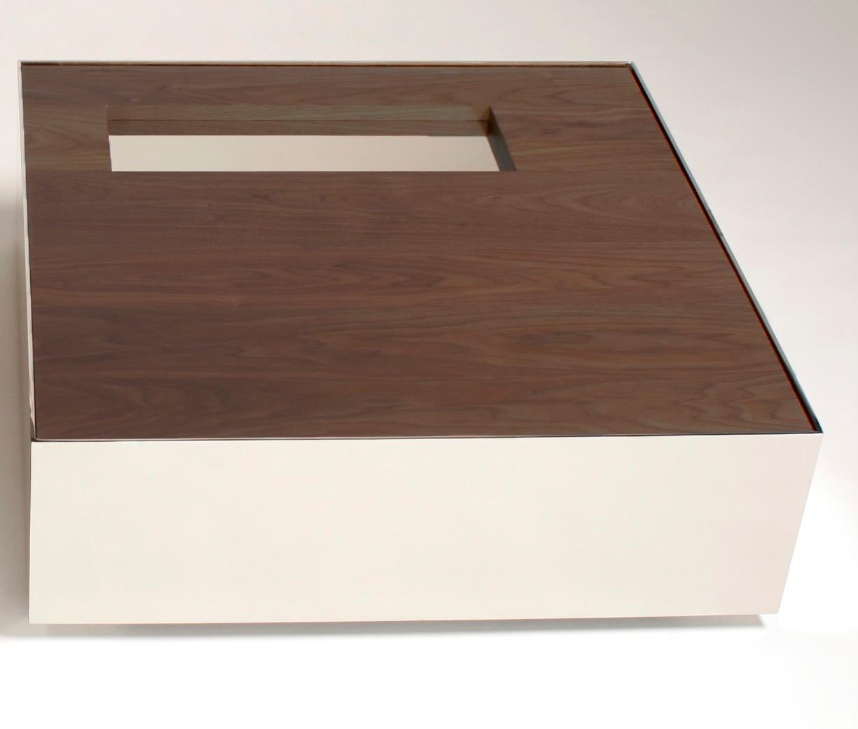 Walnut Ballot Coffee Table by Phase Design
Dimensions: D 76,2 x W 76,2 x H 25,4 cm.
Materials: Walnut and white powder-coated metal.

Steel coffee table with solid wood top, available in walnut, white oak, or ebonized oak. Available in polished
