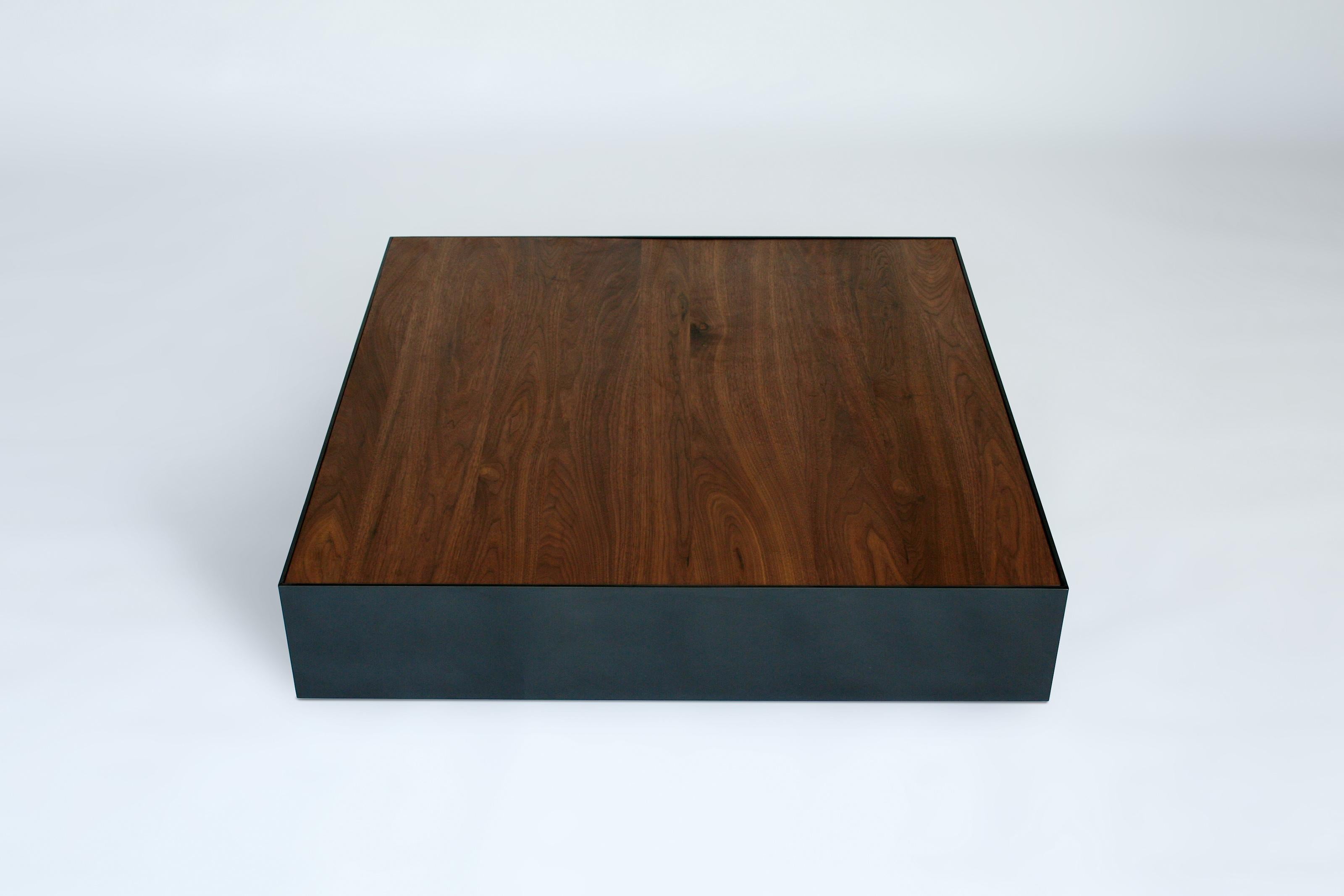 Walnut Ballot XL Coffee Table by Phase Design
Dimensions: D 106,7 x W 106,7 x H 22,9 cm.
Materials: Walnut and black powder-coated metal.

Aluminum coffee table with solid wood top, available in walnut, white oak, or ebonized oak. Available in gloss