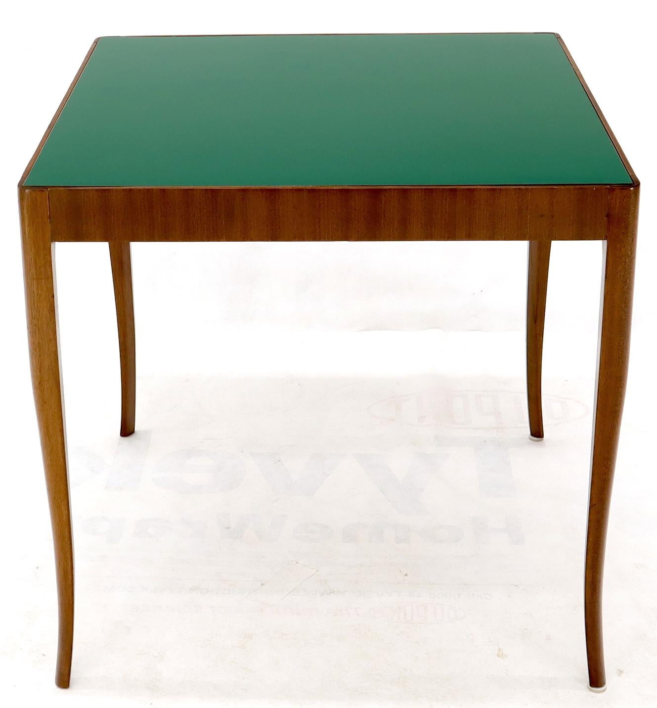 Low profile Mid-Century Modern walnut game or small dining table with laminate top.