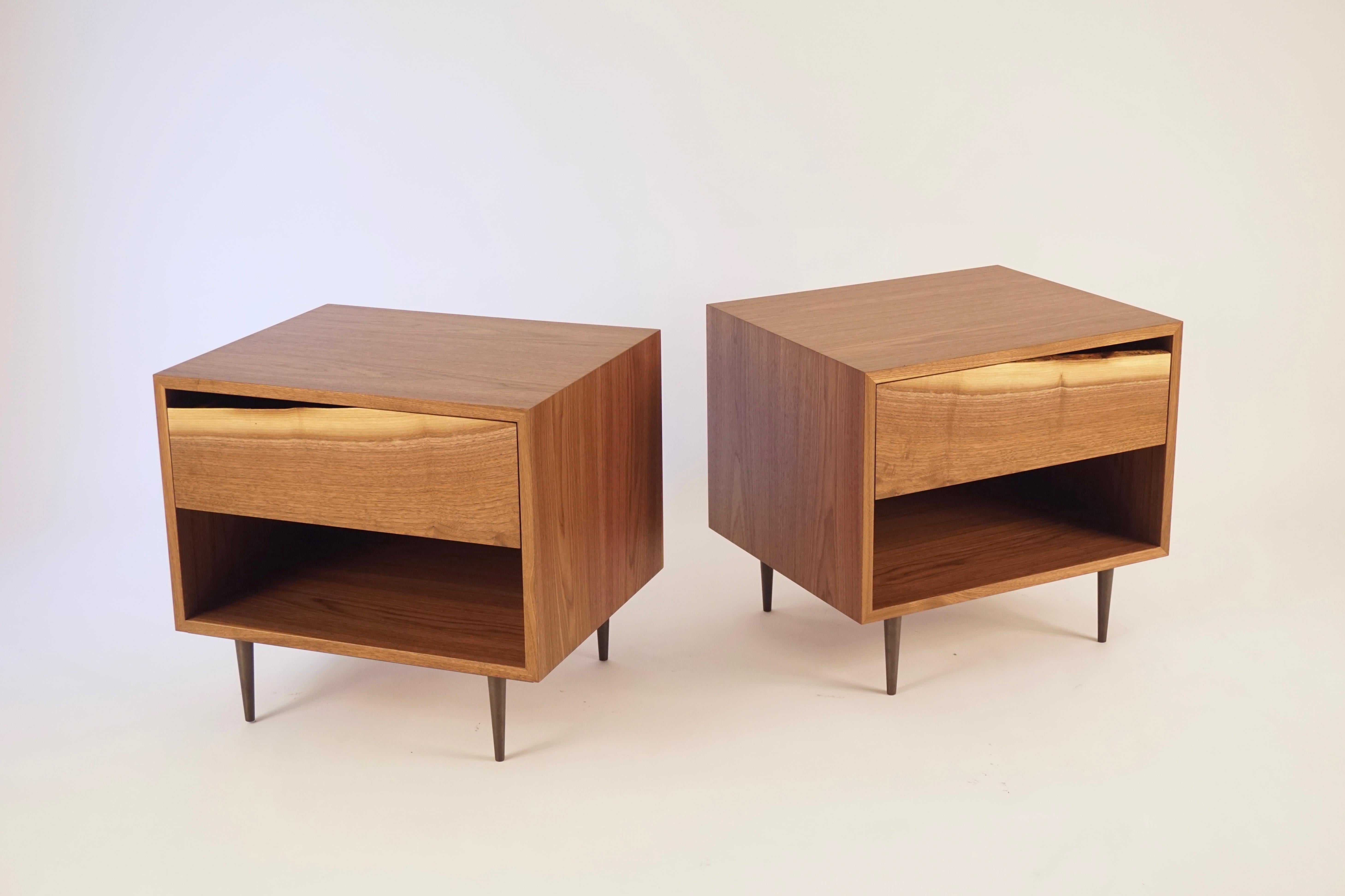 These bedside tables are from a collection of cabinets that emphasize the organic shape of the tree as a functional handle for the drawer faces. Each piece, or group of pieces, use boards from the same tree, as they appear after milling. The bases