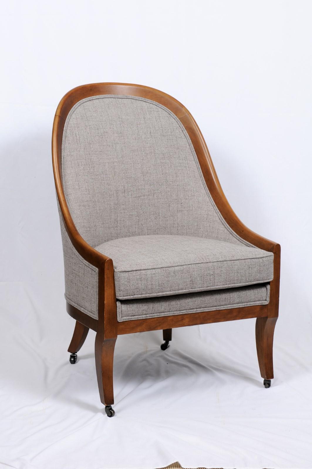 Baker Furniture Co. pair of chairs, walnut frames: Curved form back and arms with cabriole legs tapering to caster feet. Loose seat cushions. They measure H. 40