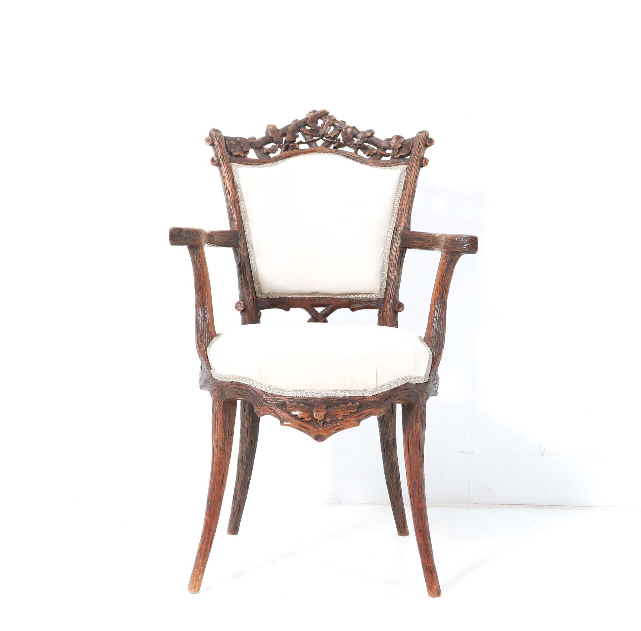 Magnificent and ultra rare Black Forest armchair. Design by Matthijs Horrix for the famous Dutch cabinet makers Horrix Den Haag. Striking Dutch design from the 1880s. Solid hand-carved walnut base and re-upholstered with a quality white fabric. This