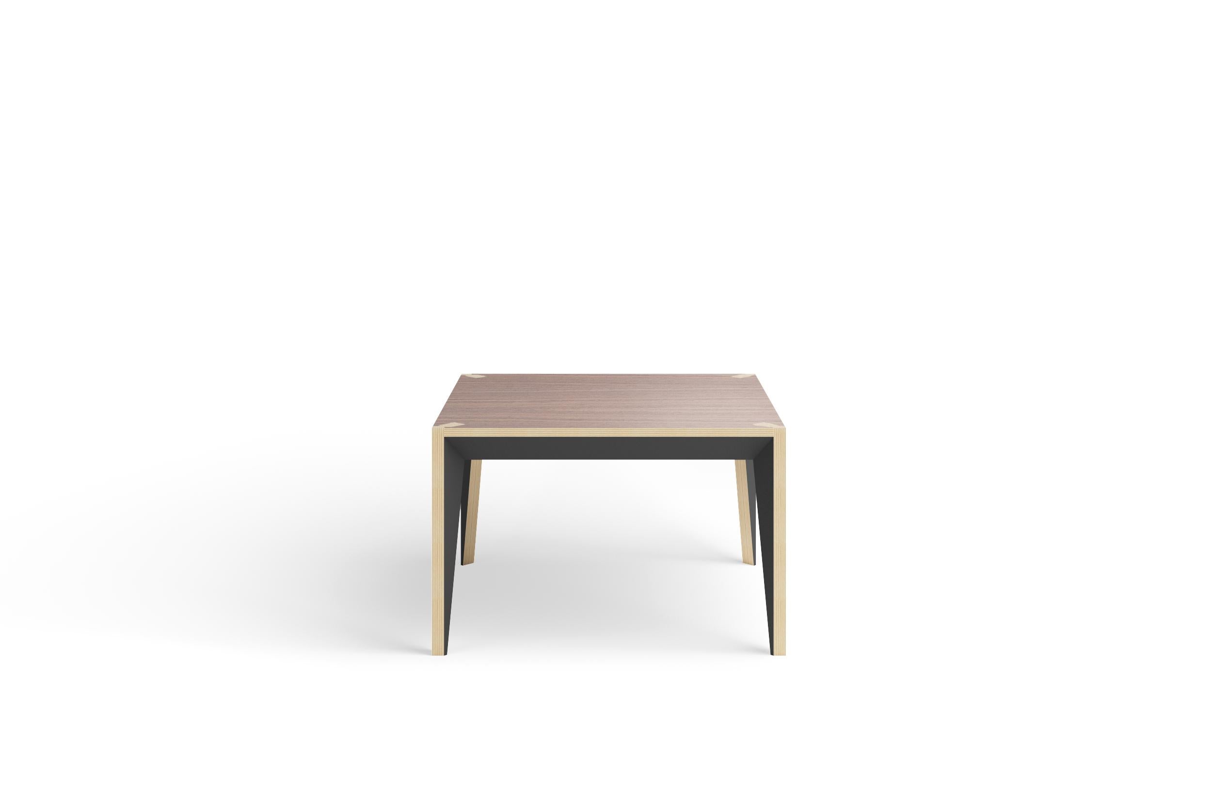 Merging clean lines with warm materials, the faceted geometry of the MiMi square coffee table creates a slender, elegant profile punctuated with painted surfaces that capture light. This handcrafted modern and graceful design looks great from all