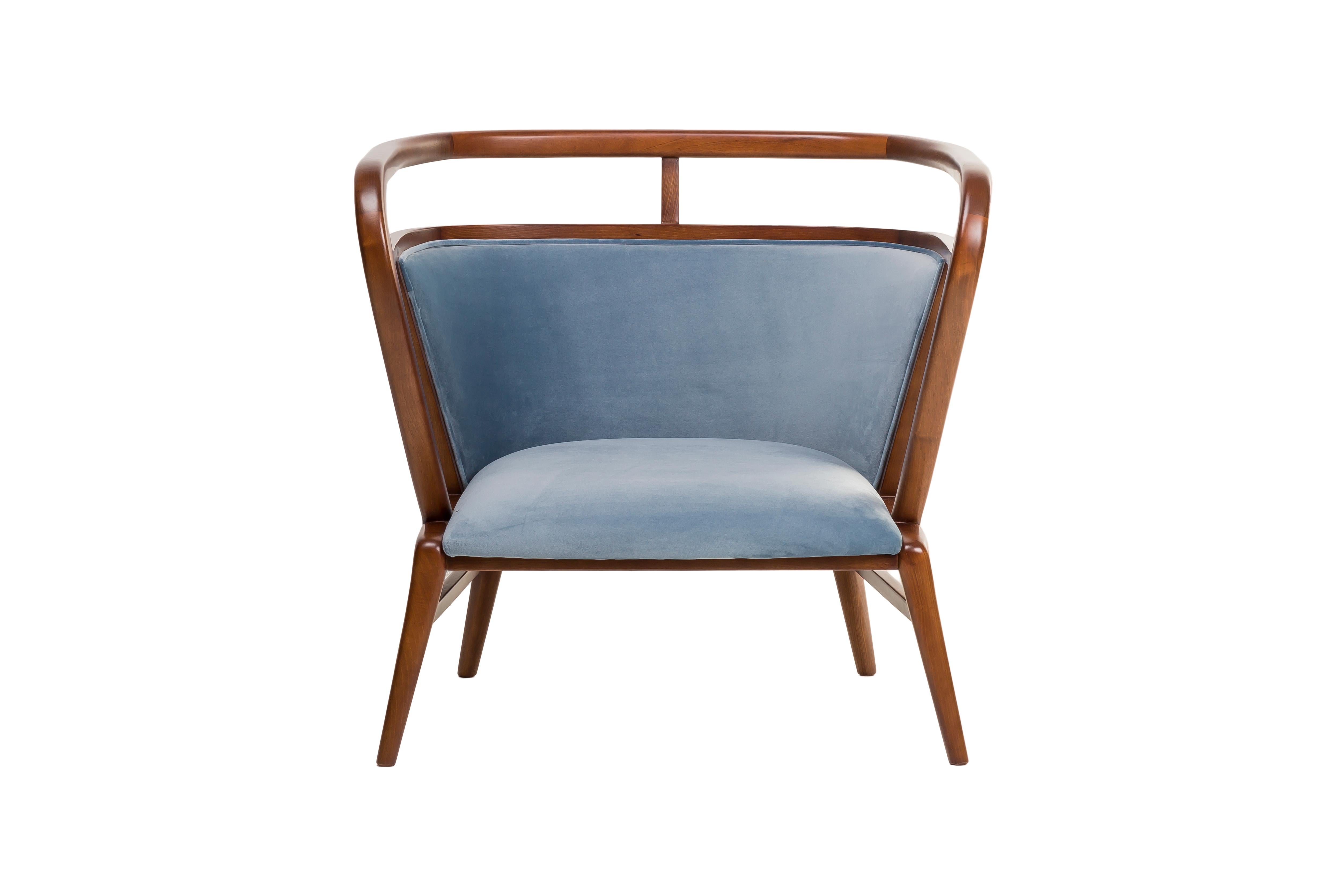 The Empire Armchair, part of the Empire collection, blends minimalist design with the luxury of velvet upholstery and the warmth of a walnut frame. This armchair is crafted to provide not only comfort but also a sense of sophistication, seamlessly