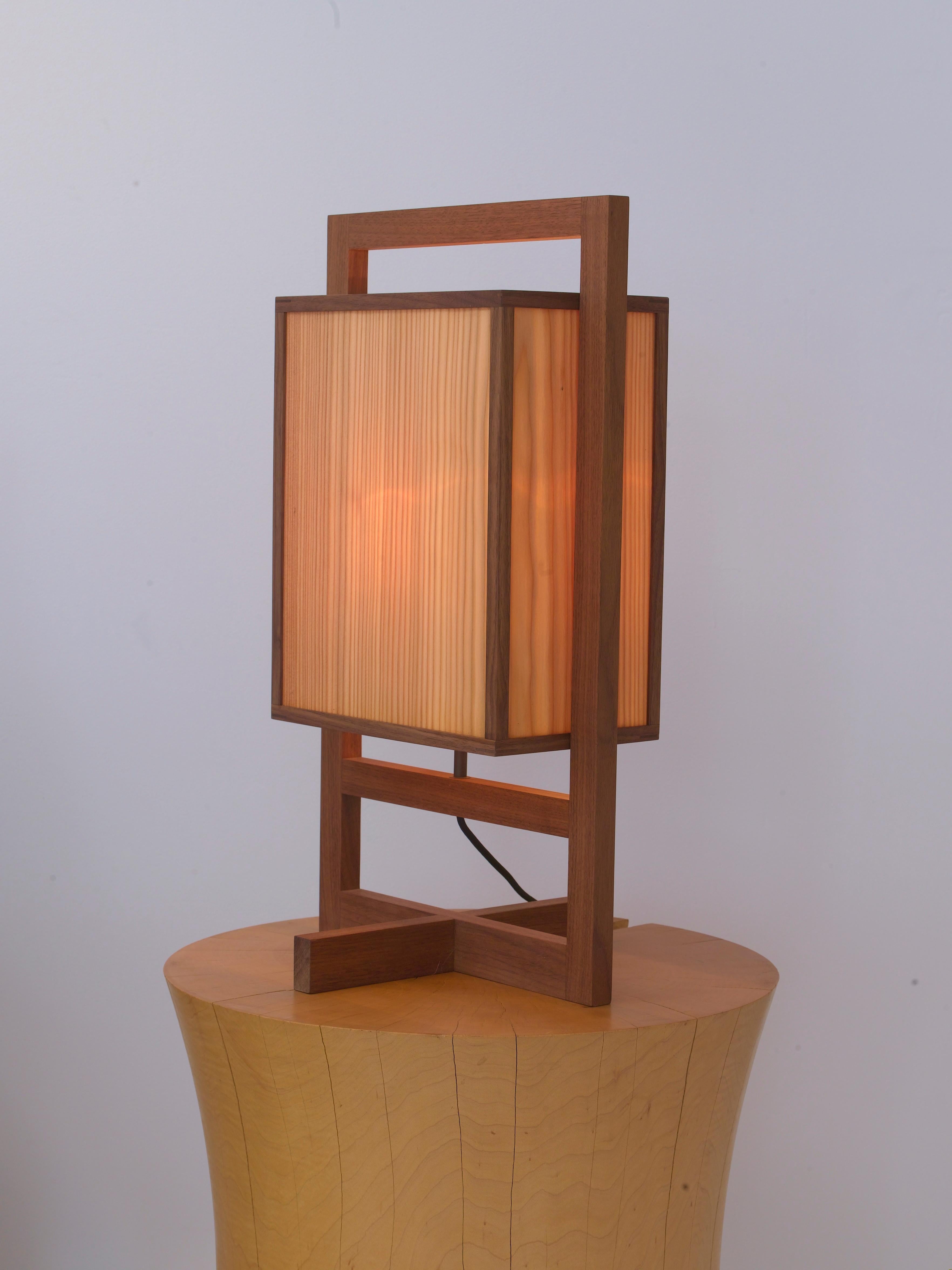 The small box lamp is one of a group of lamps designed by Chris Lehrecke in 2008. They were influenced by Japanese lanterns, as well as early Frank Lloyd Wright Designs. The lamps are beautifully crafted in Lehrecke's own studio with larch veneers