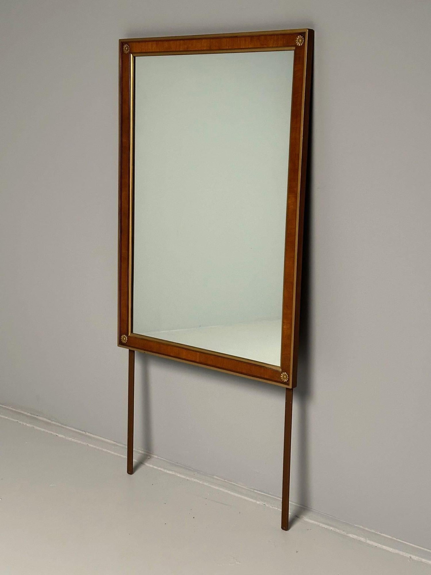 Walnut Bronze Mounted Hollywood Regency Wall or Dresser, Console Mirror

Most likely by Milo Baughman this rectangular wall mirror can hang vertically or horizontally. The center walnut frame surrounding a clean clear mirror with double bronze
