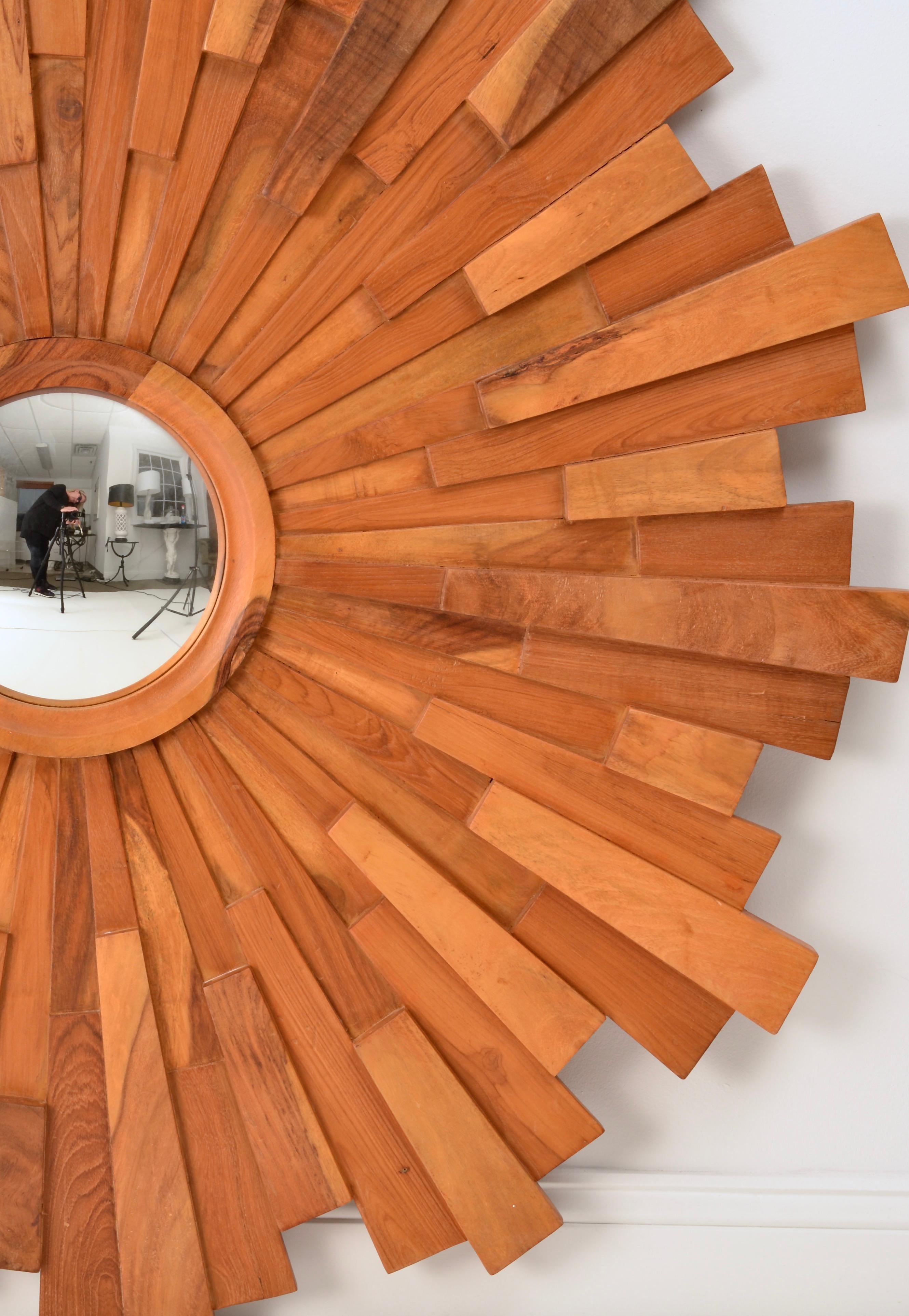Wonderful size on this piece. Brutalist-style layers of solid walnut surround a center bulls-eye mirror. Quality construction. Warm natural oiled finish. Solid back. Measure: 48
