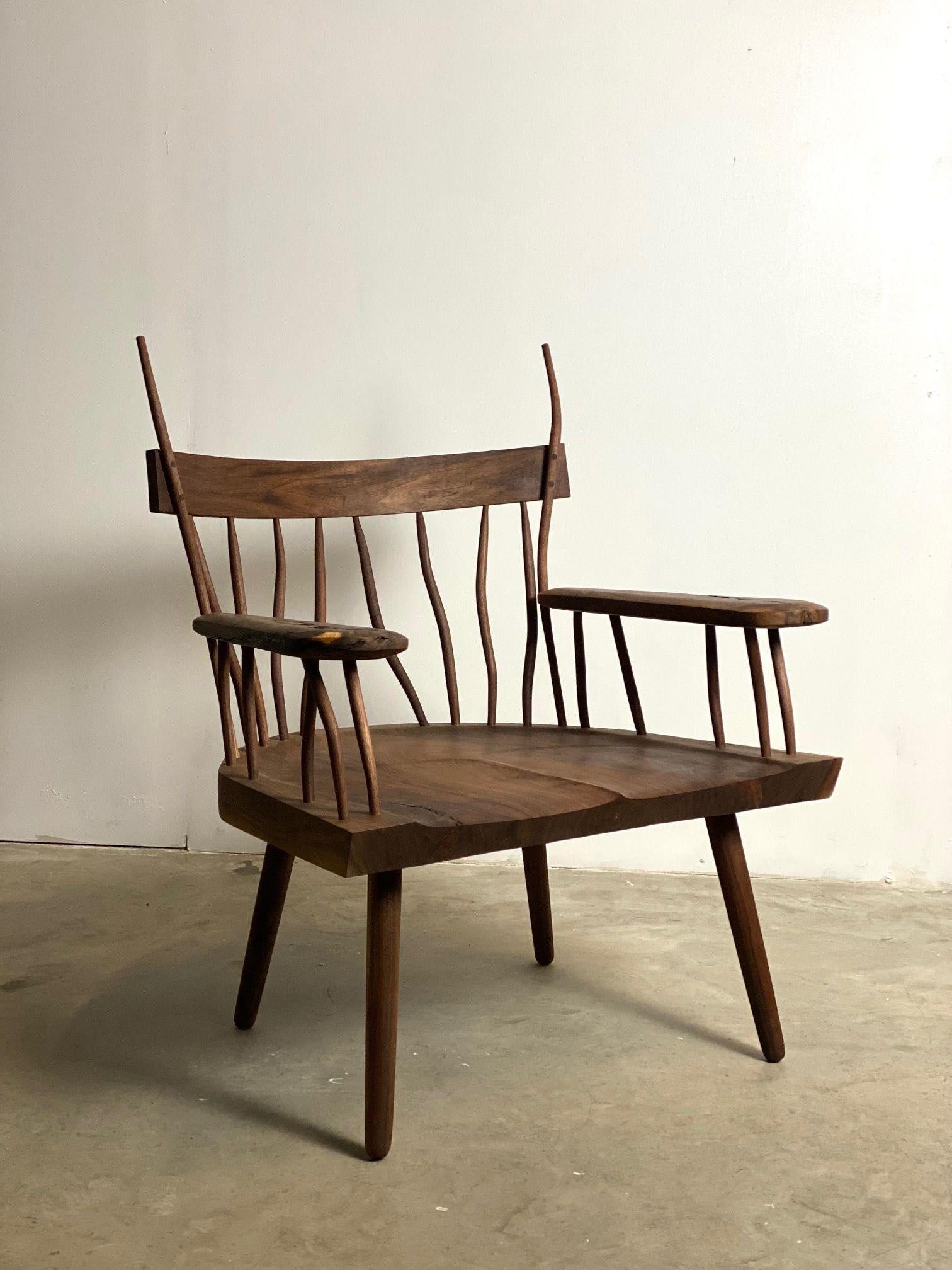 Walnut burl “Creek Chair“ lounge chair with inlay butter fly connectors. Each spindle is first lathe turned then steam bent. Hence each chair is unique.