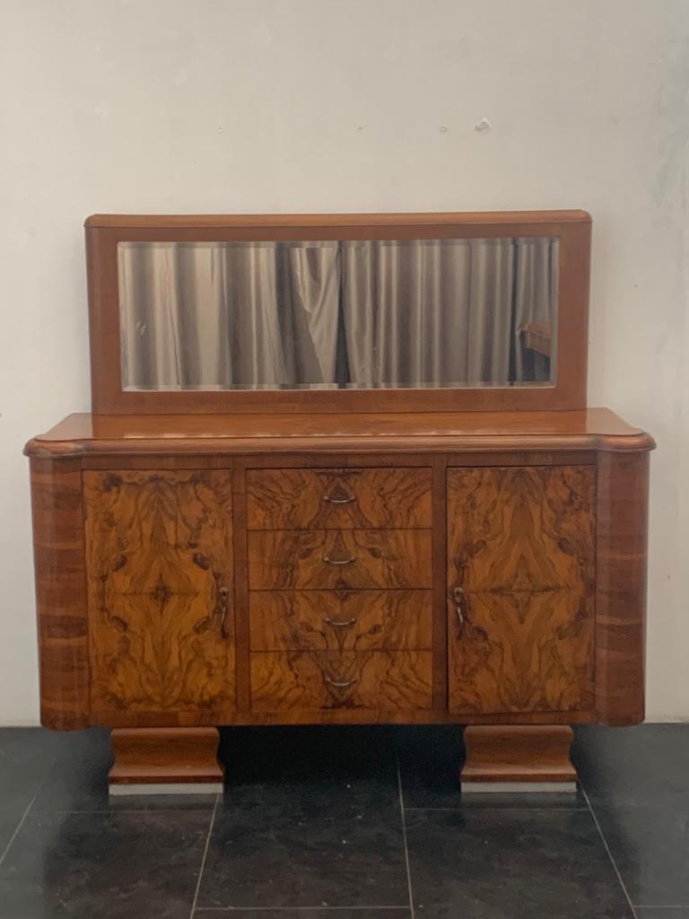 Sideboard with mirror in walnut and briar walnut, 1940s. With mosee lines and steel profiled feet.