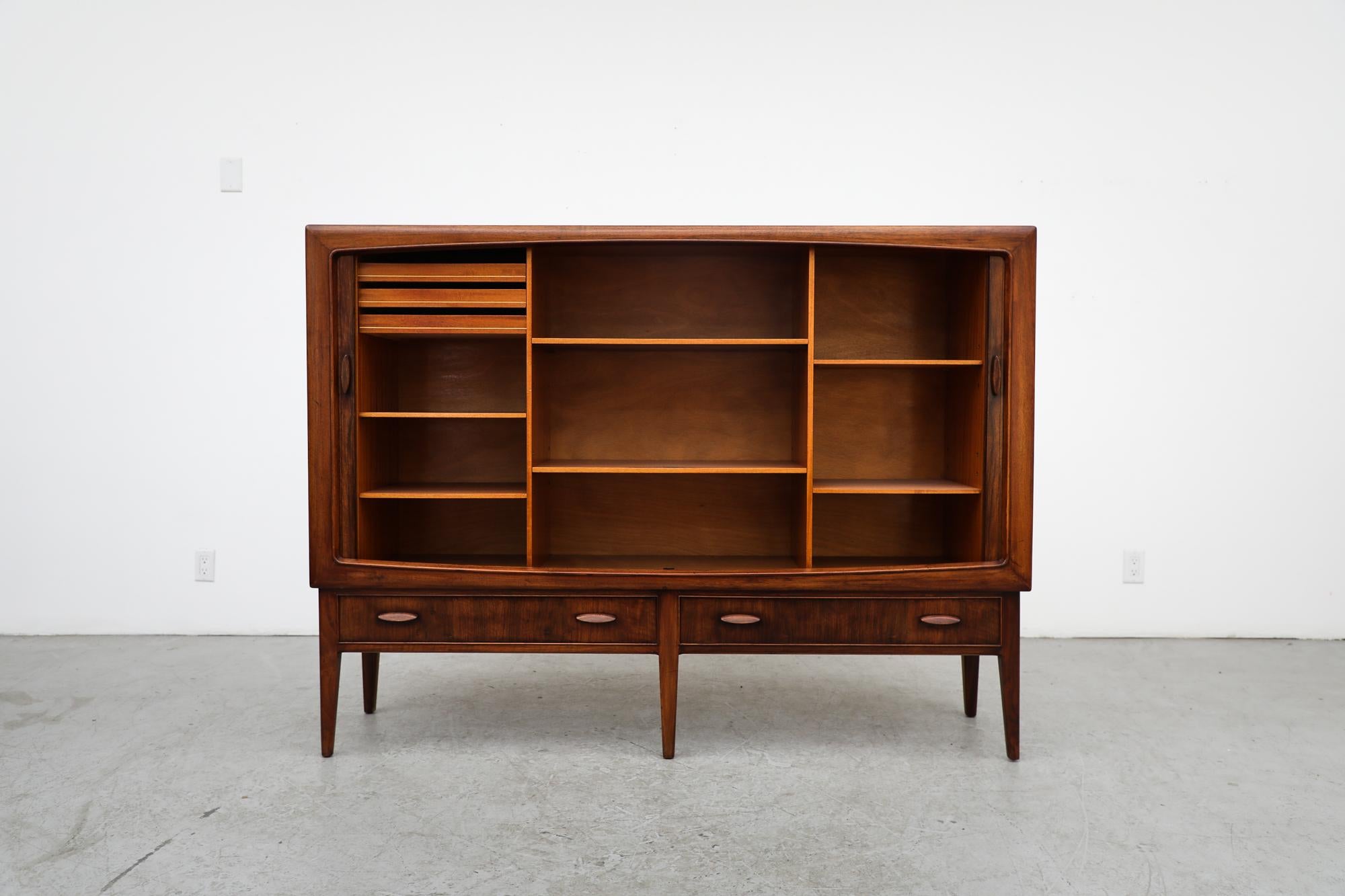 Walnut Cabinet by Kurt Østervig for Brande Mobelfabrik, 1960's. This piece has tambour doors that open to reveal shelving and inner drawers. In original condition with visible wear consistent with its age and use.
