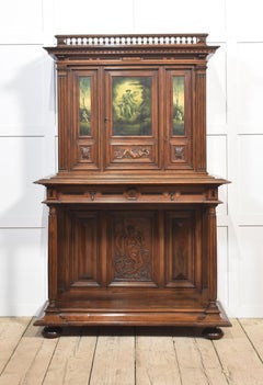 Walnut carved cabinet on stand
