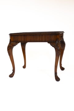 Walnut & carved coffee table with drawer