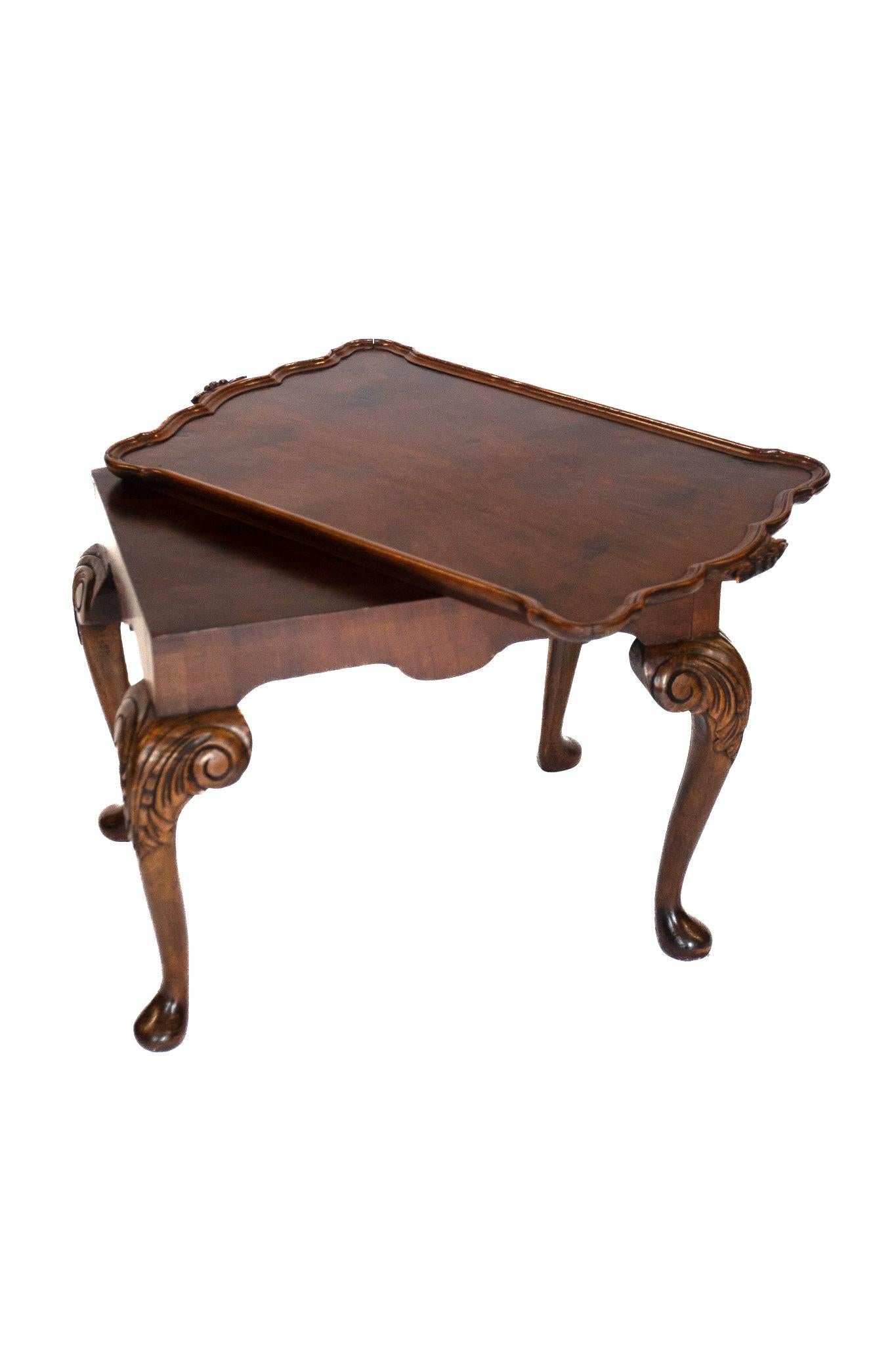 Walnut & Carved tray top coffee table, circa 1930s
Rectangular shaped top with figured walnut, Carved moulding
around edge, Pair carved detail on handles,
Top overlapped on base, 
Lift off tray top. 
Base: Walnut with 4 cabriole shaped carved