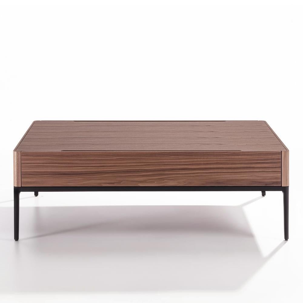 Coffee table walnut case with black 
lacquered aluminium base and with 
solid walnut top with 2 drawers.