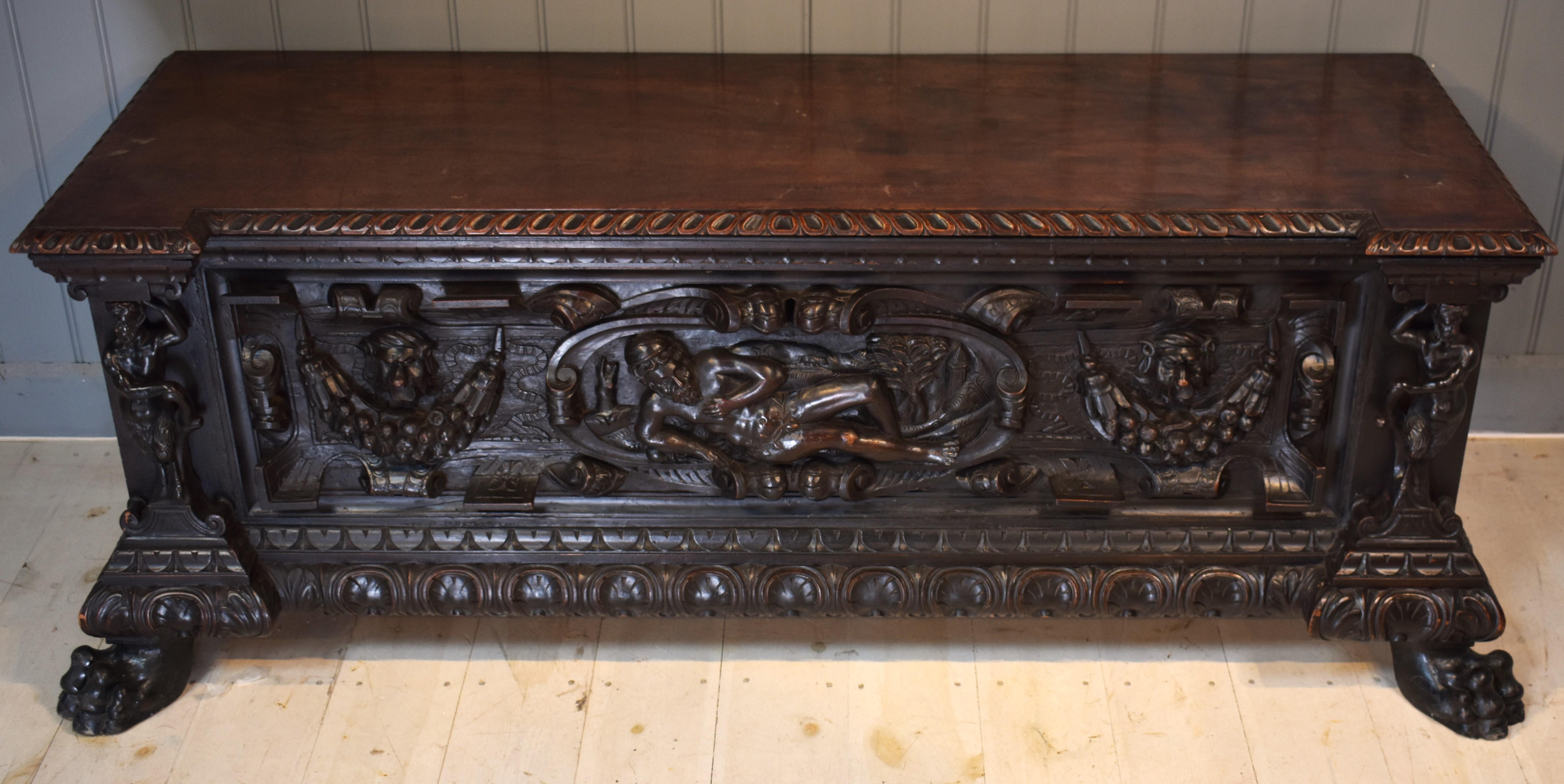 Italian Walnut cassone with carved front For Sale