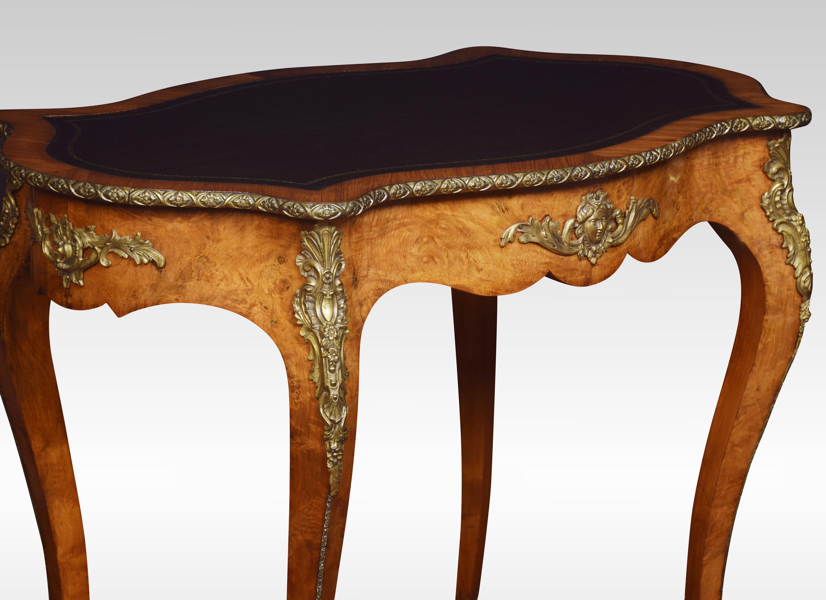 19th century walnut writing table the shaped top with inset leather enclosed by a walnut banding. To the frieze fitted with gilt metal decoration. All raised up on four slender gilt metal mounted cabrioles supports.
Dimensions
Height 29