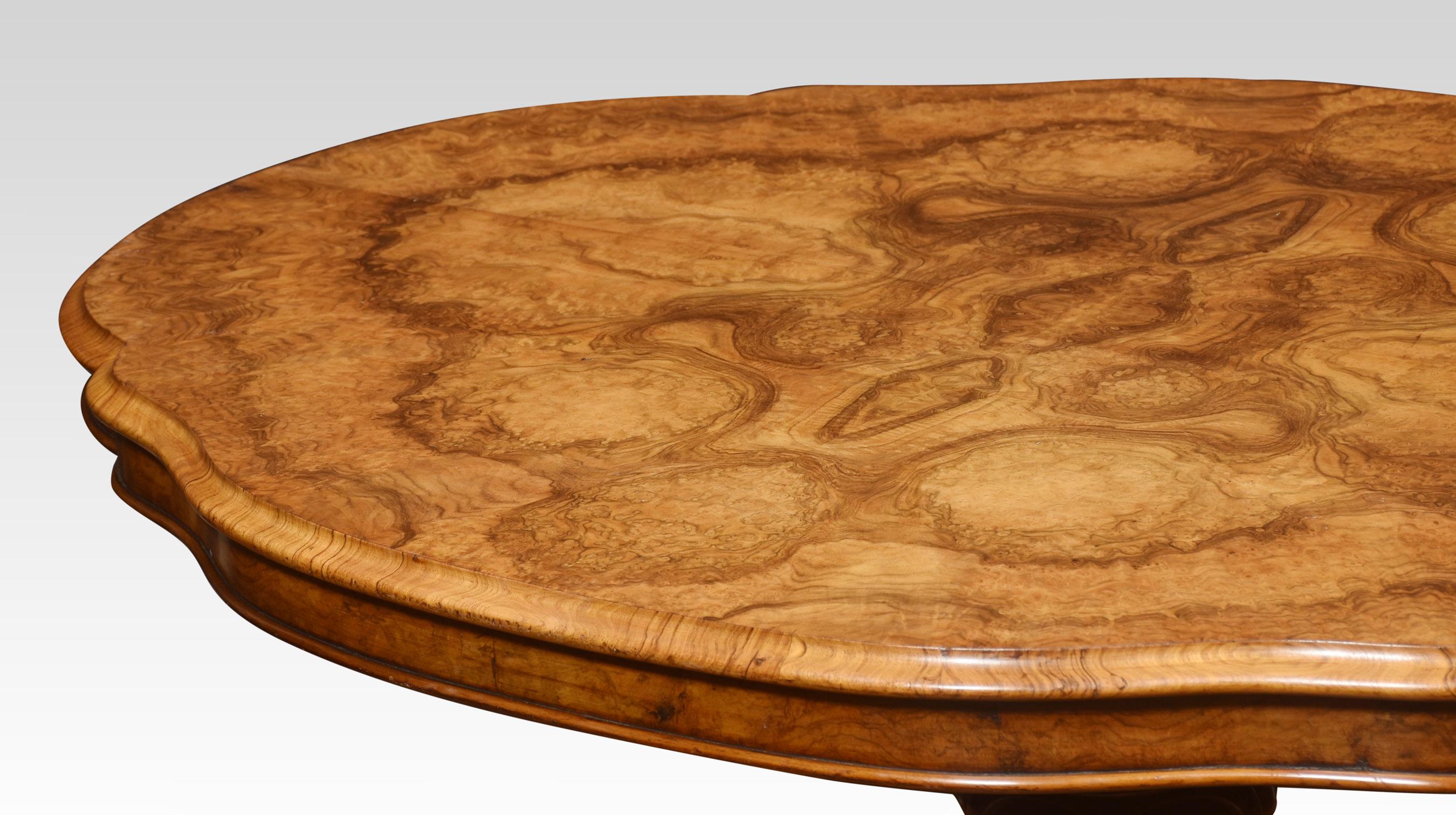 Walnut breakfast table, the large well figured-shaped top with moulded edge, raised up on carved stem supporting four scrolling cabriole legs terminating in castors.
Dimensions
Height 30 Inches
Width 54 Inches
Depth 41.5 Inches