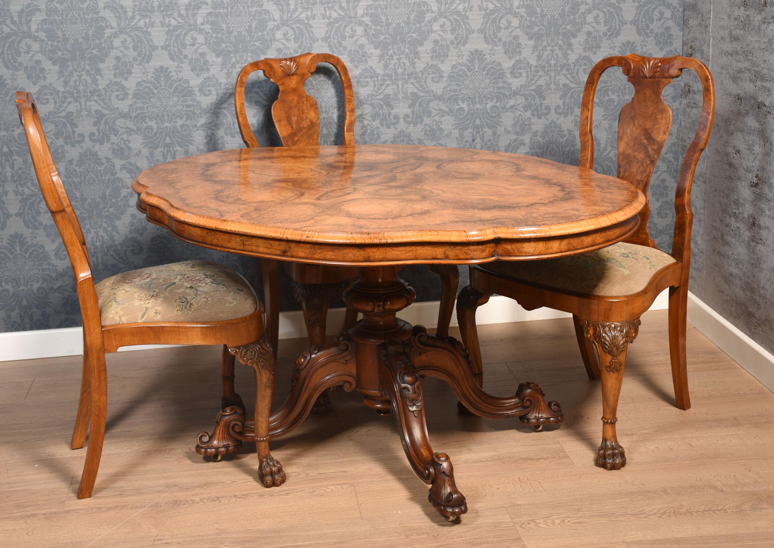 Walnut breakfast table, the large well figured-shaped top with moulded edge, raised up on carved stem supporting four scrolling cabriole legs terminating in castors.
Dimensions
Height 30 Inches
Width 54 Inches
Depth 41.5 Inches