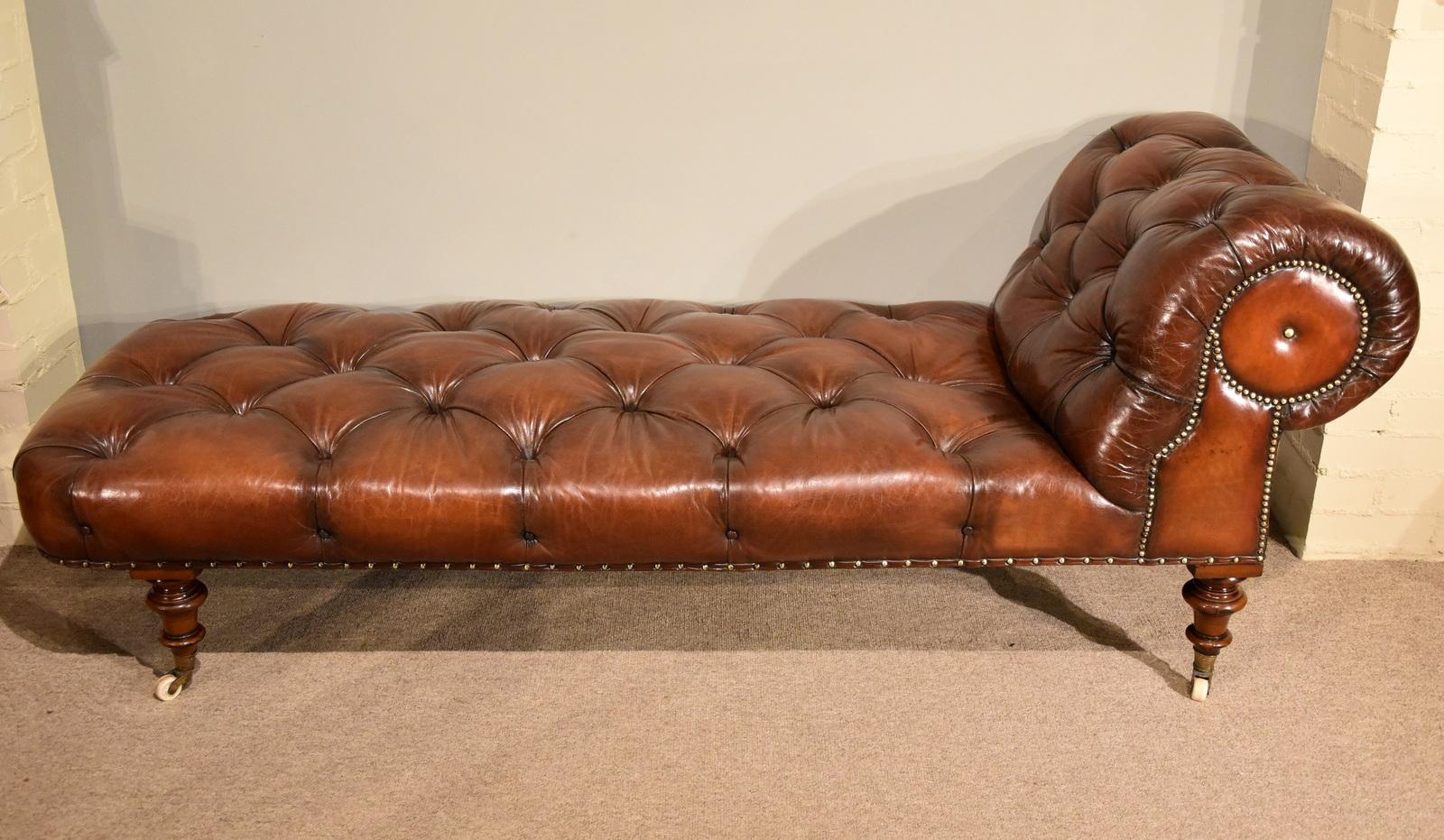 Stunning quality mid-19th century walnut chaise reupholstered in deep buttoned chestnut antiqued leather with brass studs

Dimensions:
Height 30