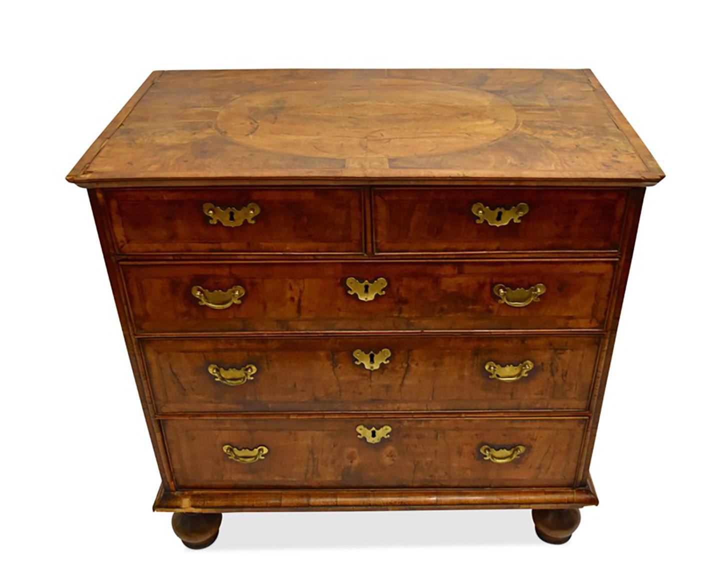 William & Mary walnut chest.

The inlaid top over 2 short drawers and 3 long drawers each with pen line inlay and the whole on bun feet.

Restoration needed.
