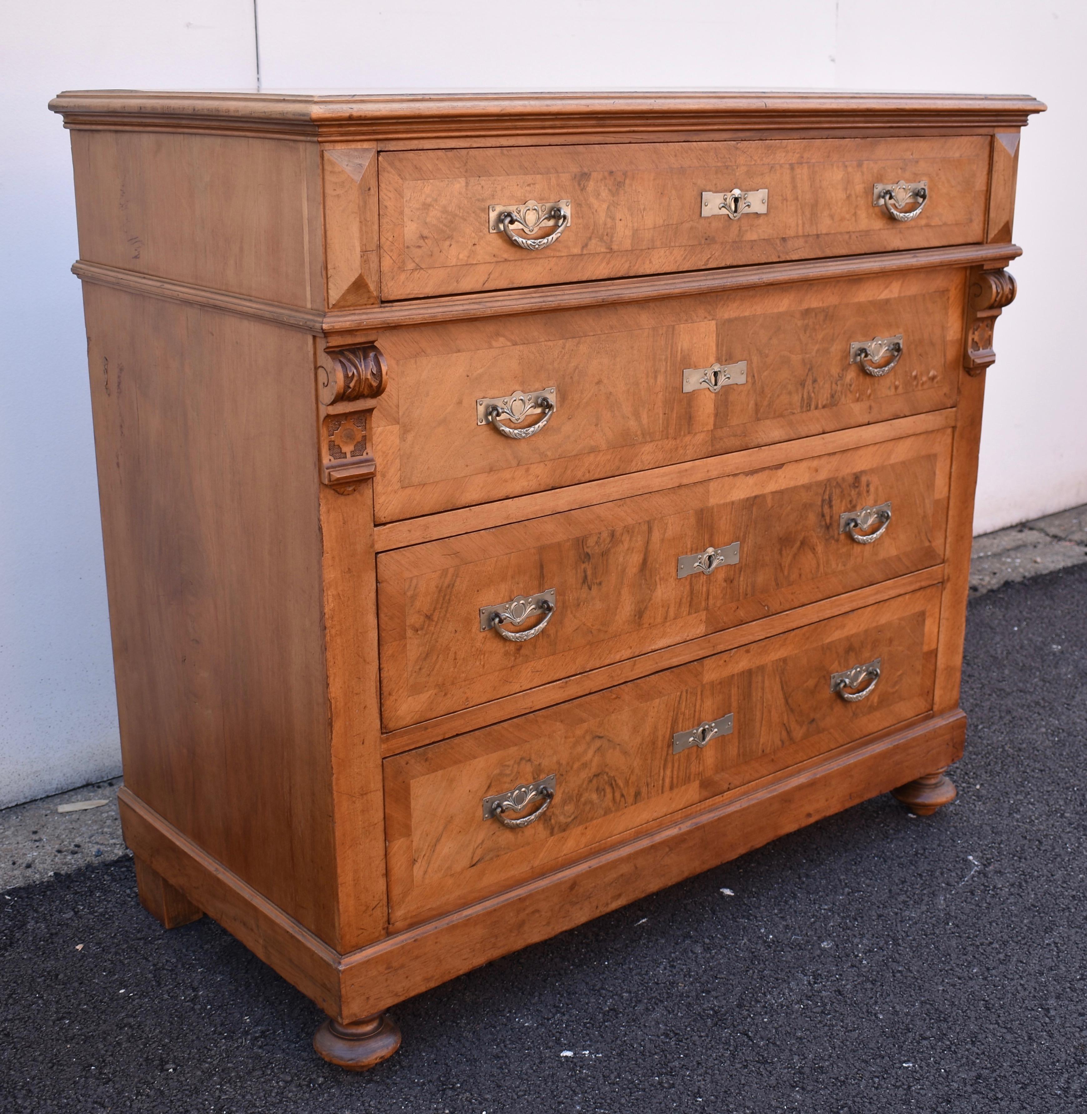 What a handsome chest of drawers, and how well-made! In a rare foray into the world of hardwood, we couldn’t resist buying this solid walnut chest with parquetry veneered drawers. The top has a step-down routed edge, the front corners are plain with