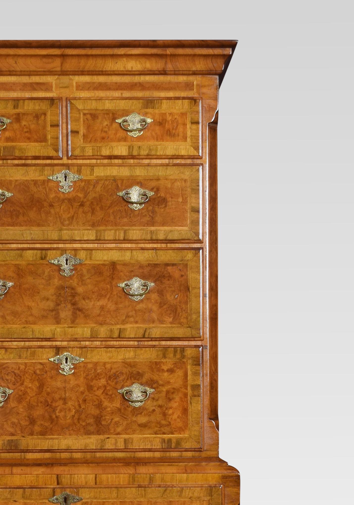 18th century style walnut tallboy, of slender proportions, the moulded top above two short and three long graduated drawers. The base fitted with four long graduated drawers all having oak drawer liners, crossbanding and brass tooled handles raised