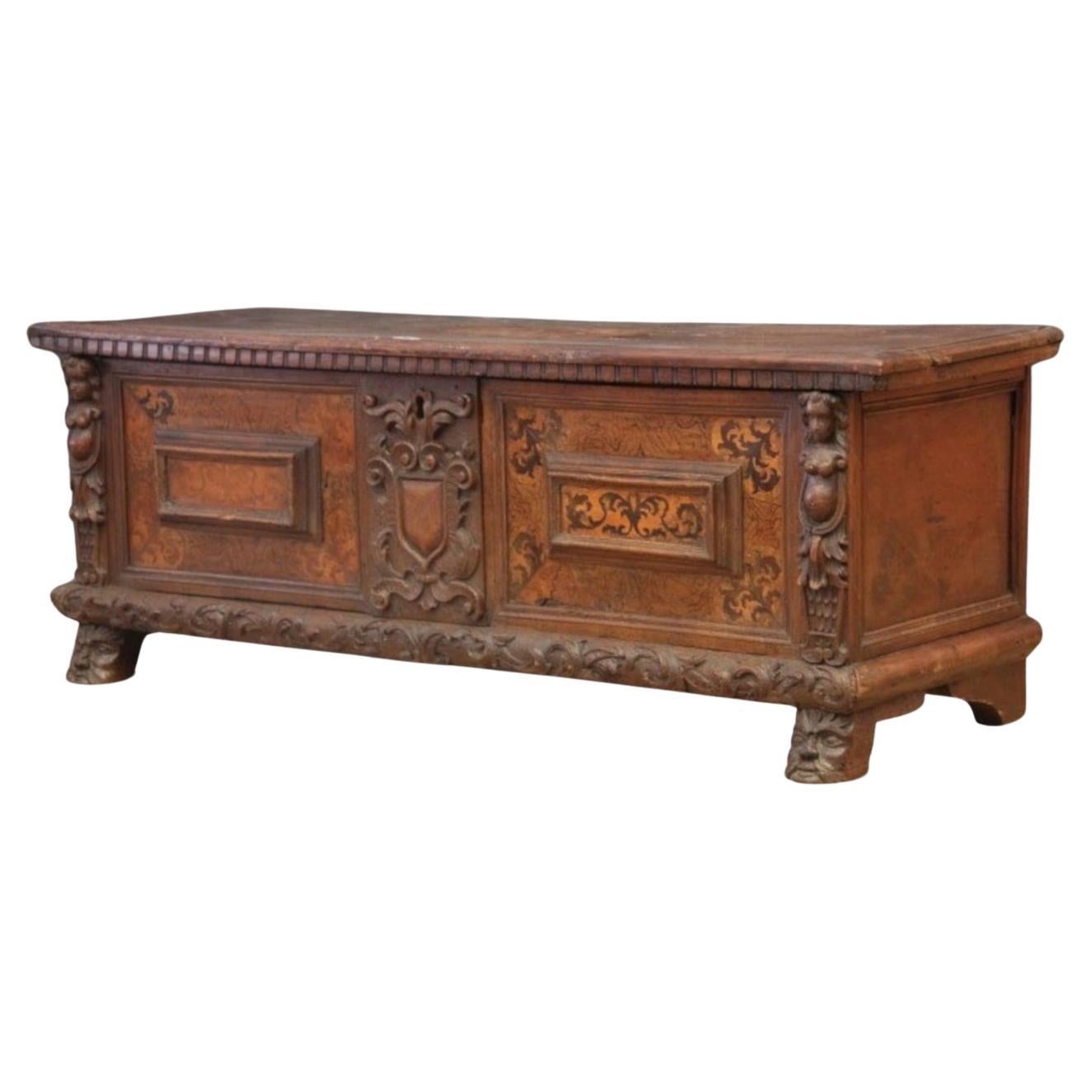 Walnut chest with maple inlays and carved friezes, from the 1600s. For Sale