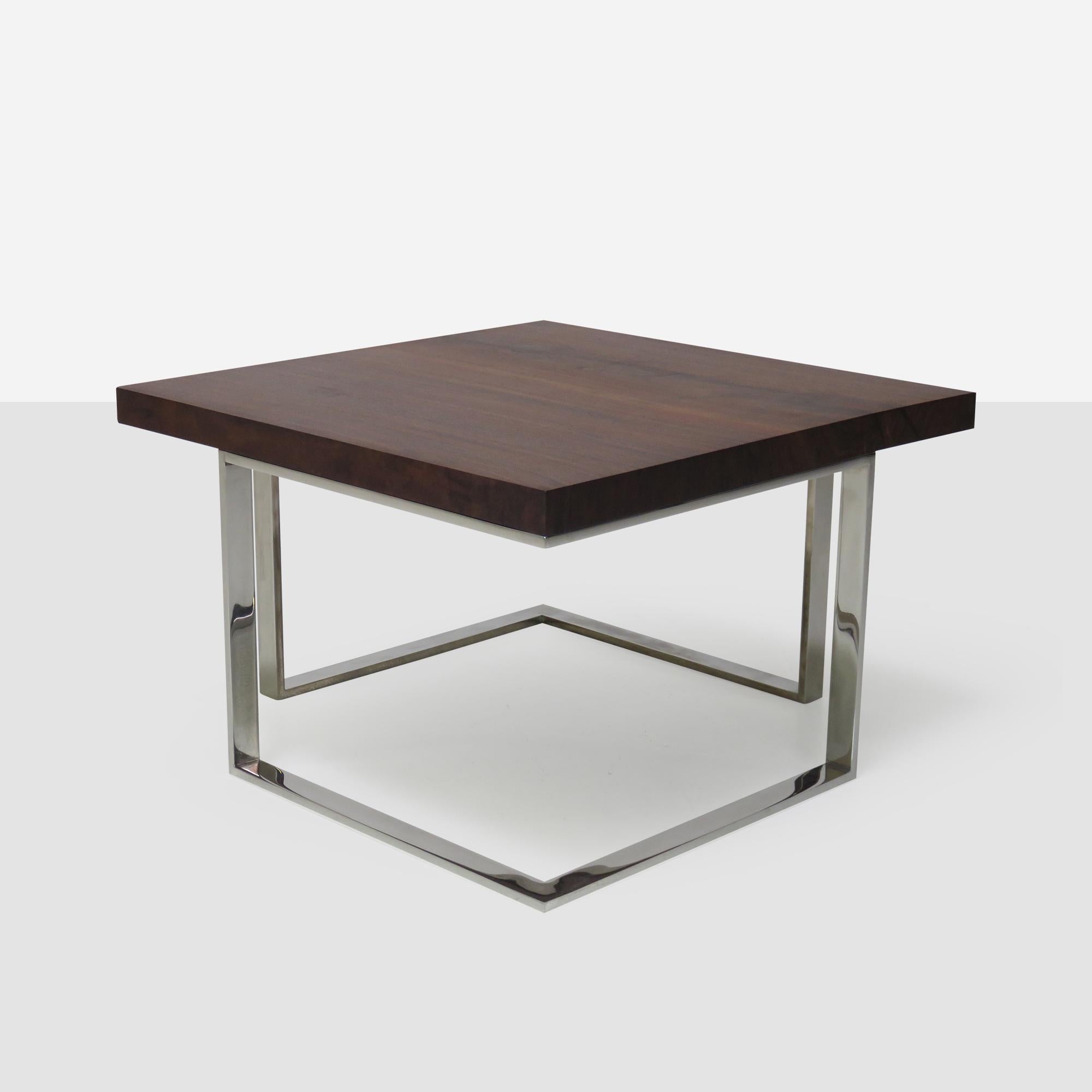 A solid walnut top on a chromed steel base. A modern construction in the style of Milo Baughman. 